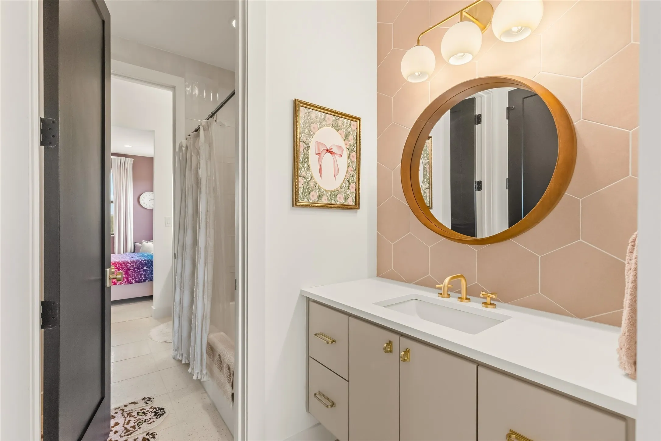 Jack and Jill Vanities with a white countertop, under-mount sink, and gold-finish faucet