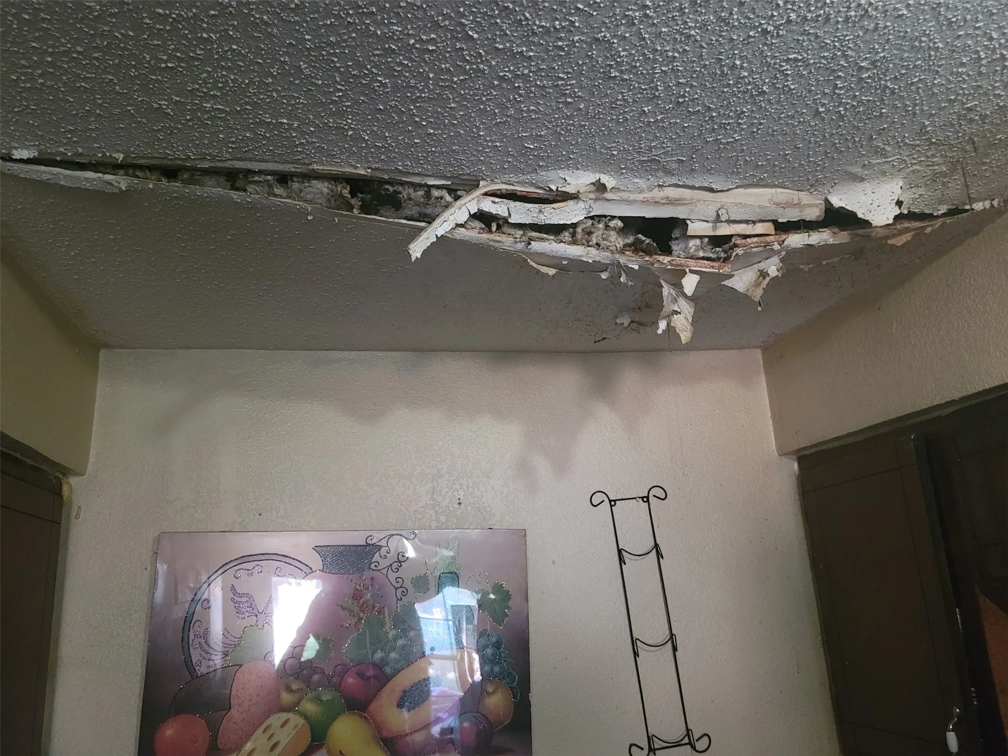 water damaged ceiling in kitchen area