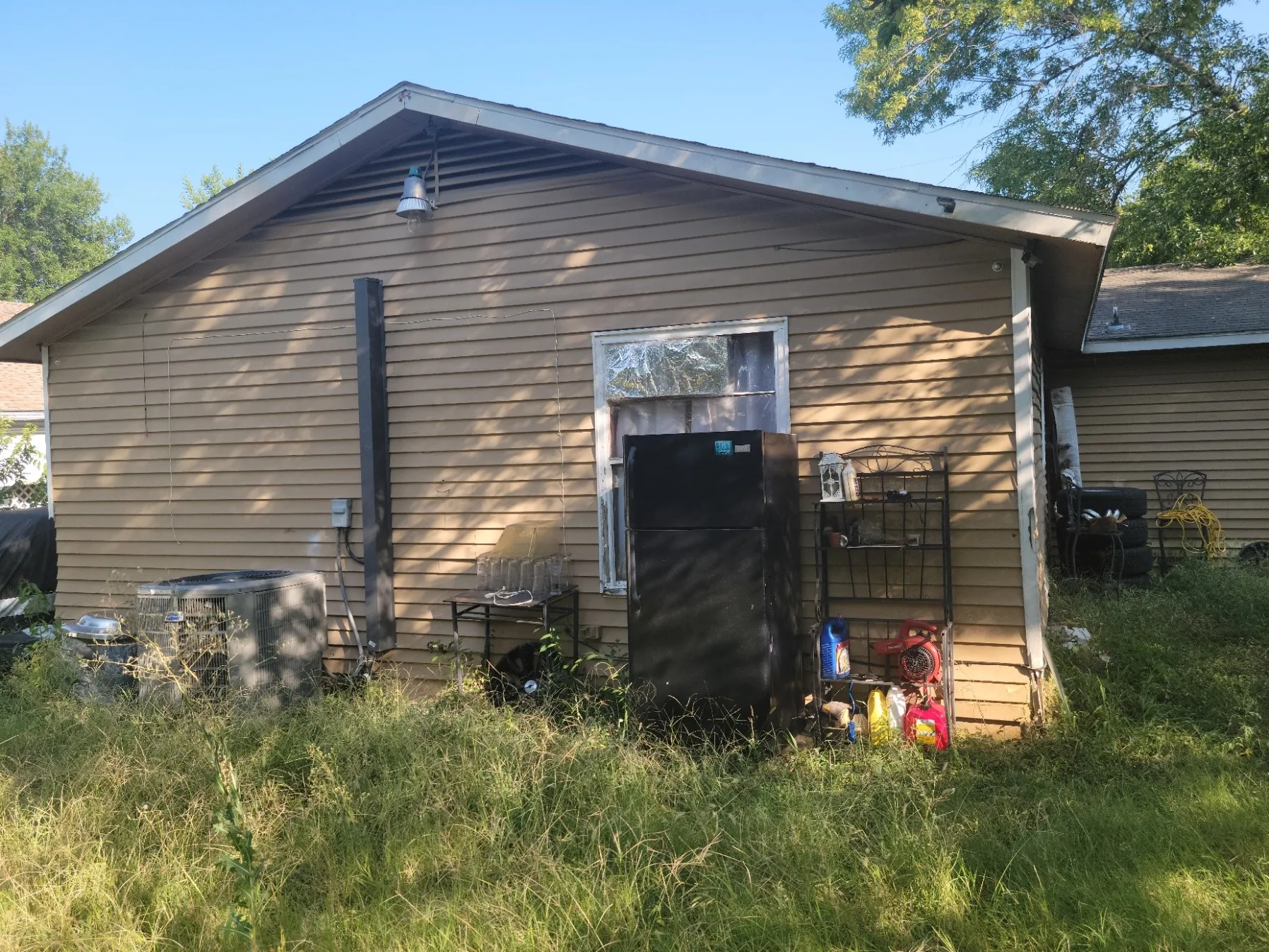 Rear of house with AC unit