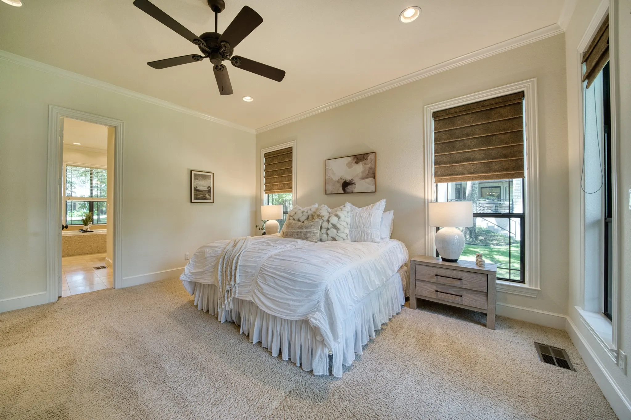 Recessed lighting, ceiling fan with light fixture, double windows with window treatments, wall-to-wall carpeting, and crown molding