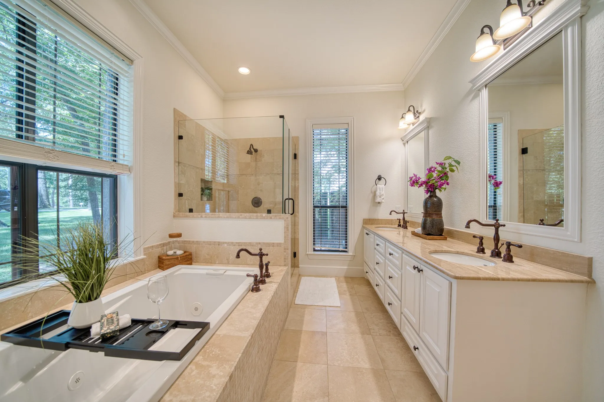 Dual vanity with white cabinetry and stone countertops