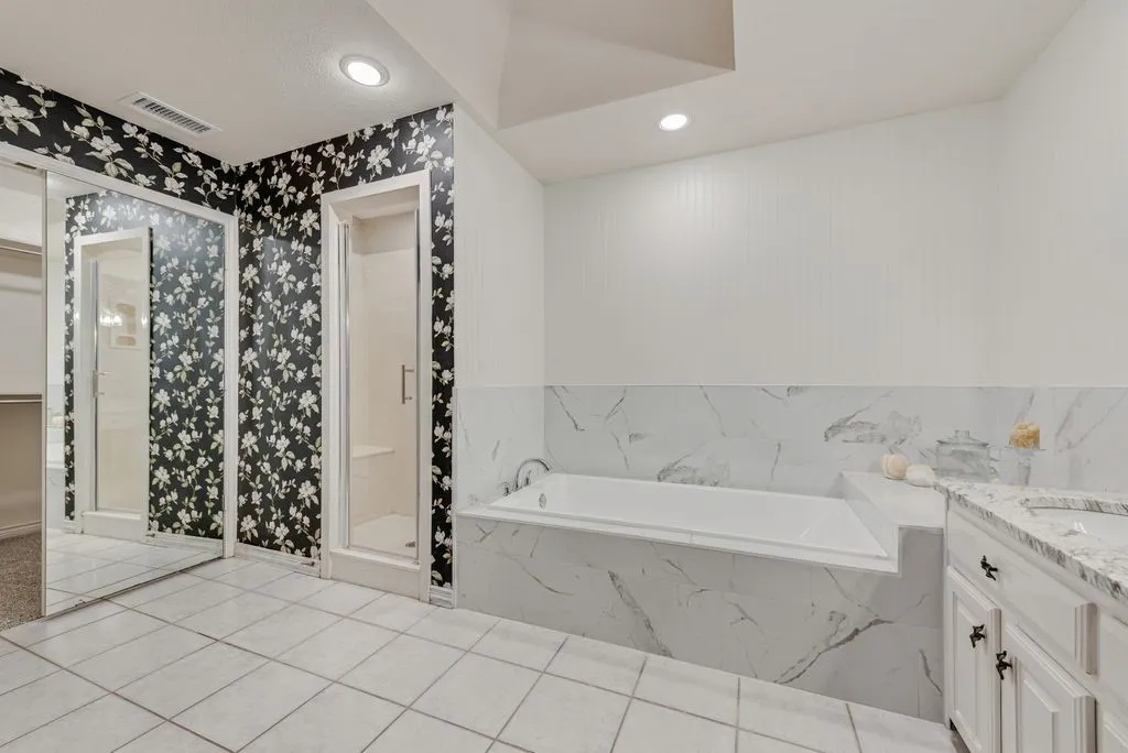 Soaking tub with marble-look tile surround