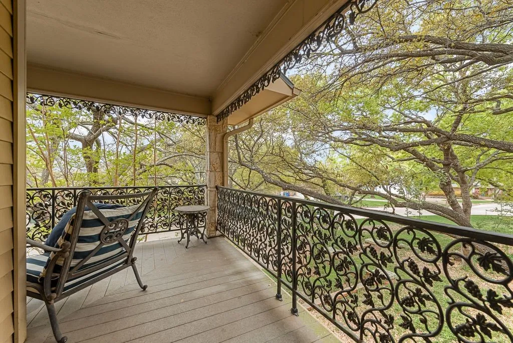 Covered outdoor balcony with wood-finish flooring