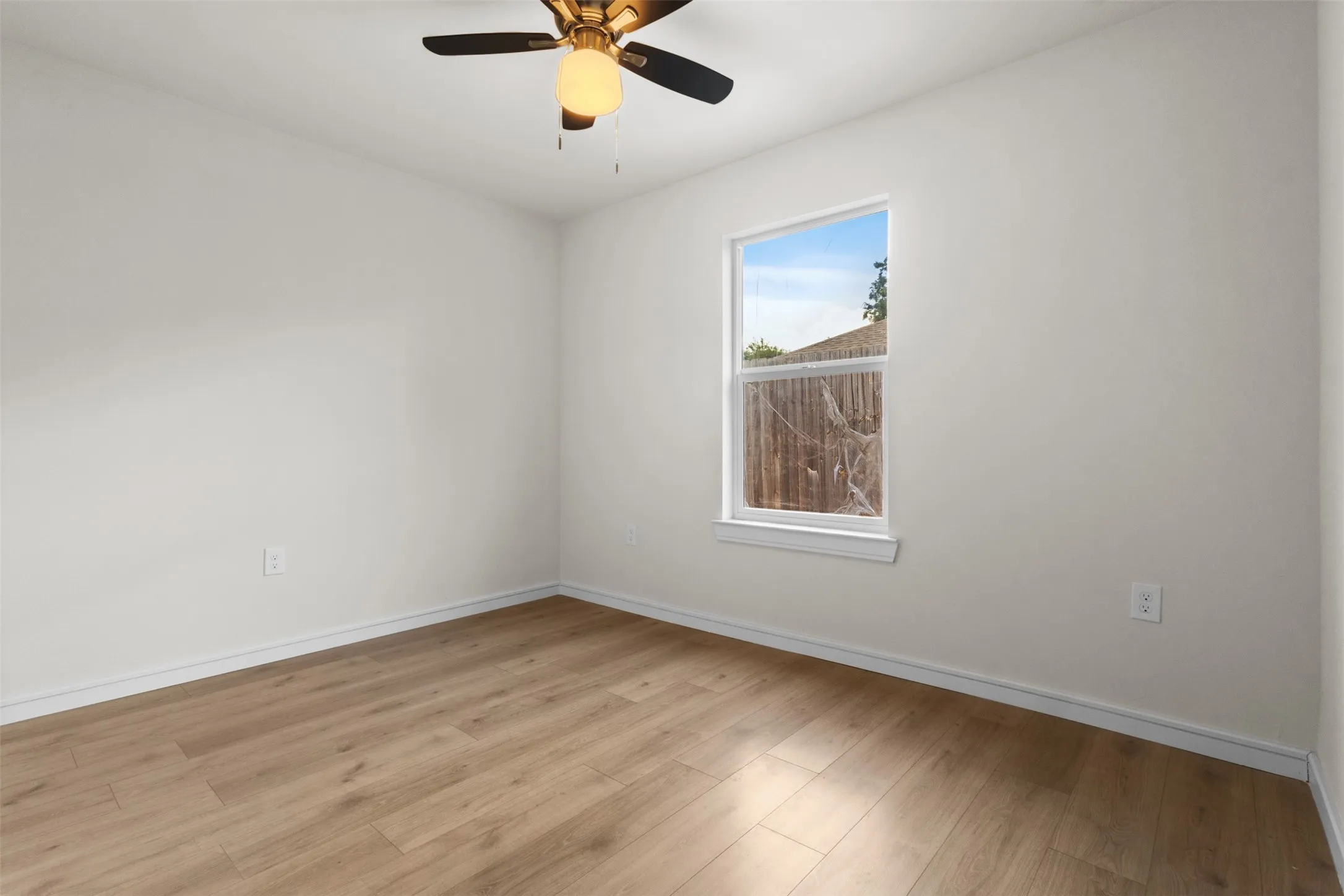 Wood-finish flooring complemented by white walls