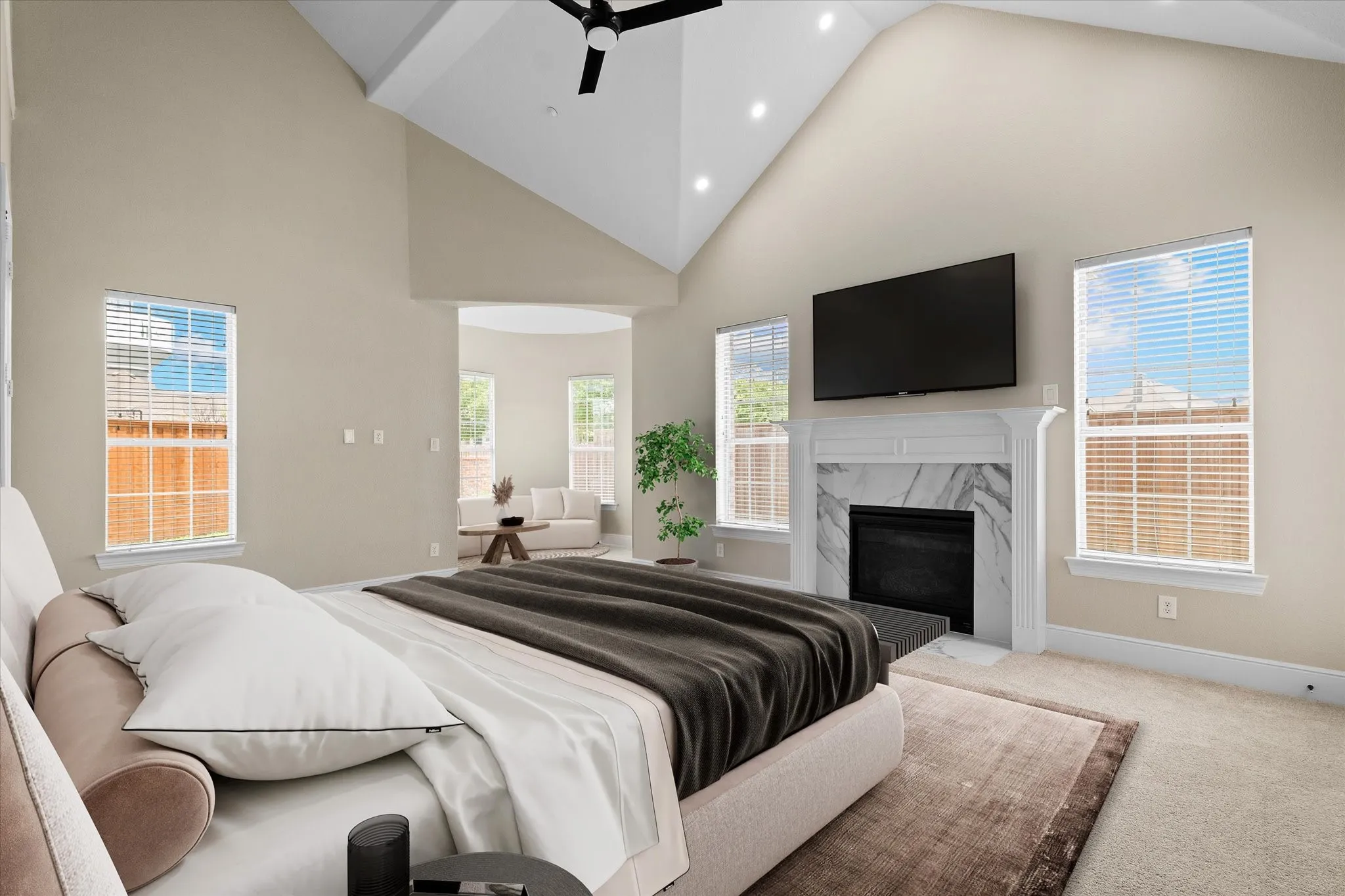 Primary Ensuite Bedroom with Fireplace Down -- Virtually staged