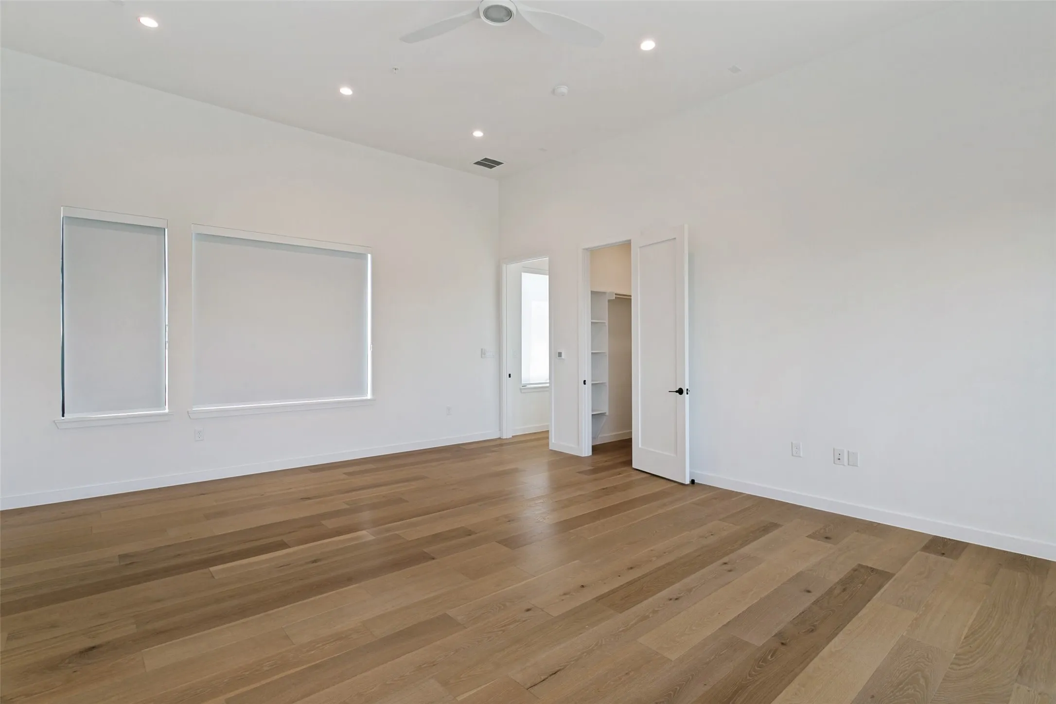 Second primary bedroom with en suite full bathroom and walk in closet. This space would be perfect for multi-generational or game/media room! Has access to deck with pergola. (3rd floor)