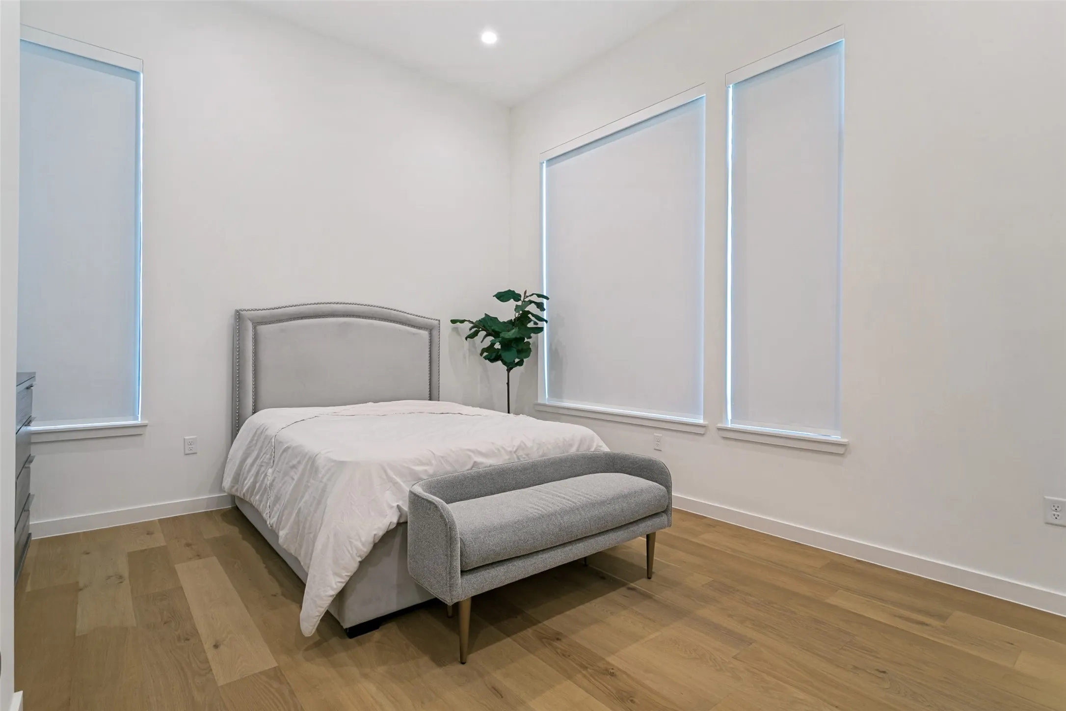 Primary bedroom with automatic blinds and en suite primary bathroom. (2nd floor)