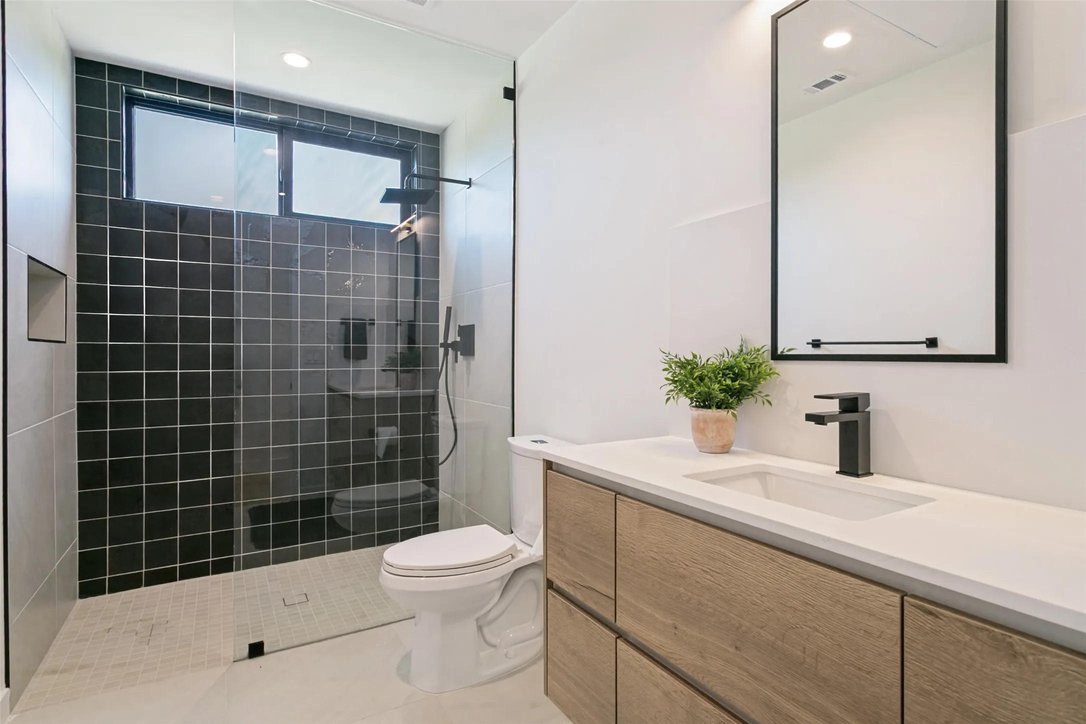 Full bathroom separating bedrooms 1 & 2. Located on 1st floor.