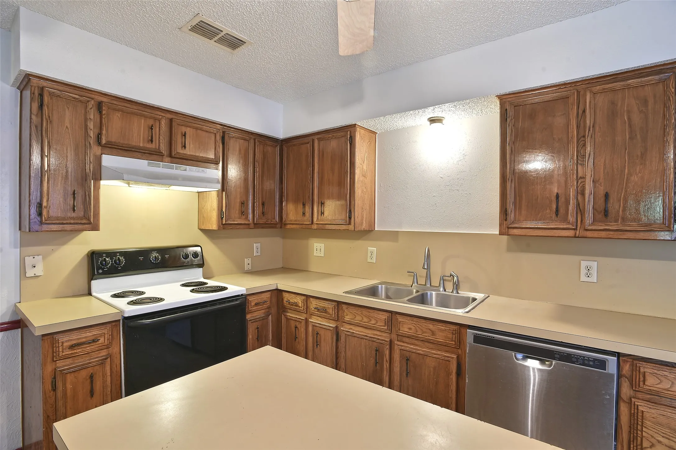 The spacious kitchen has amble countertop and storage space.