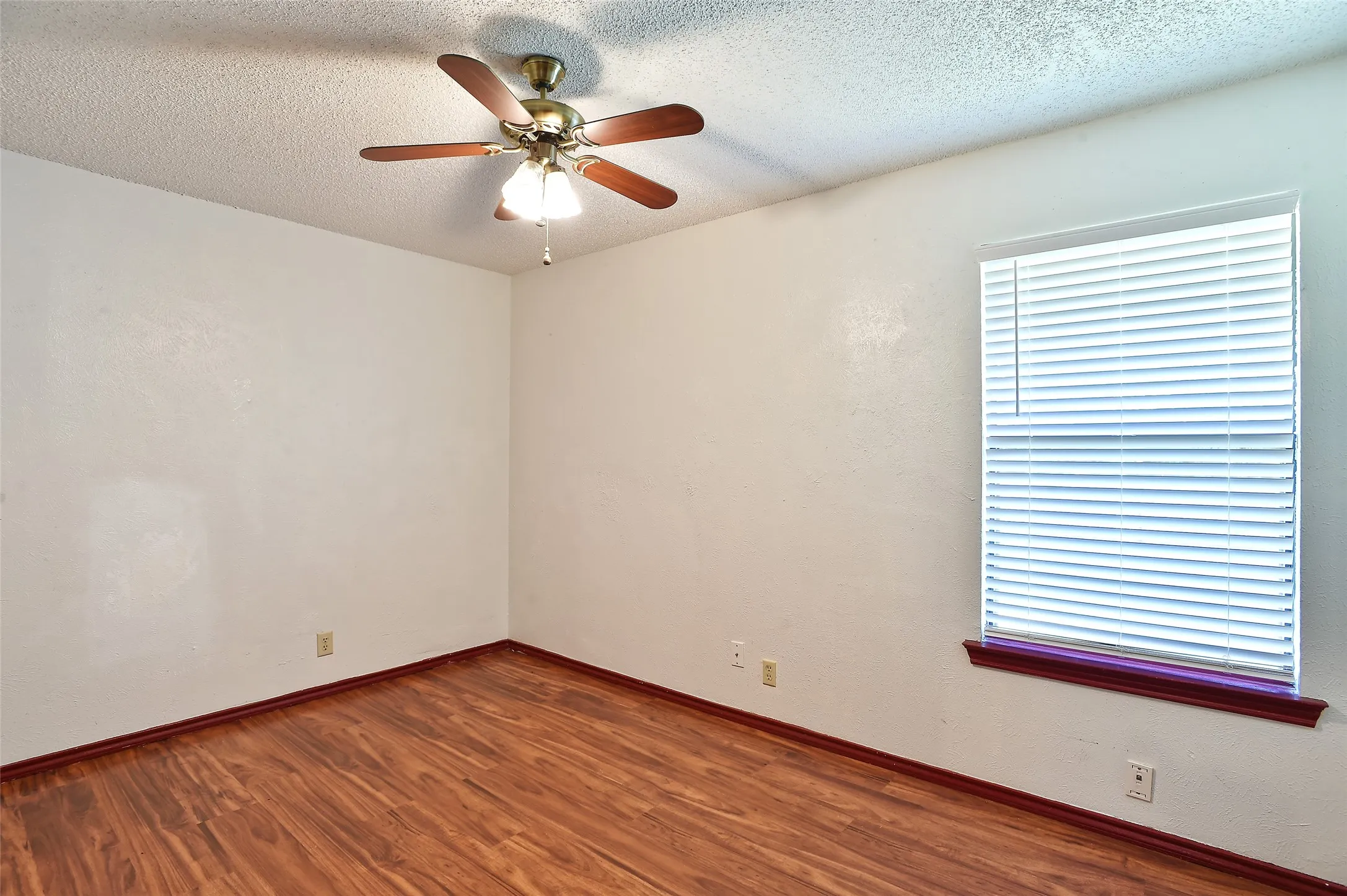Bedroom with ceiling fan.