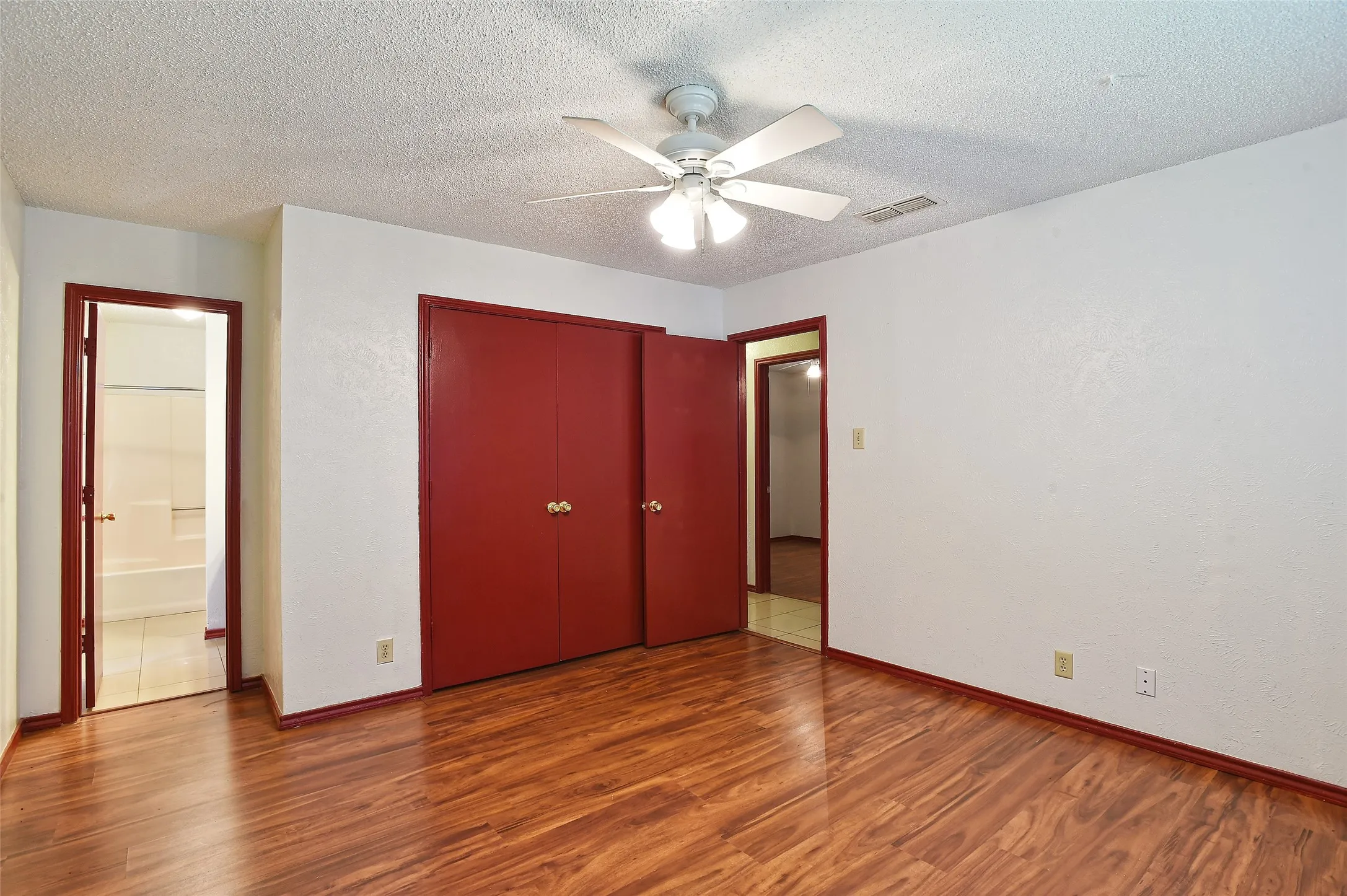 The primary bedroom has a ceiling fan, large closet and ensuite bathroom.