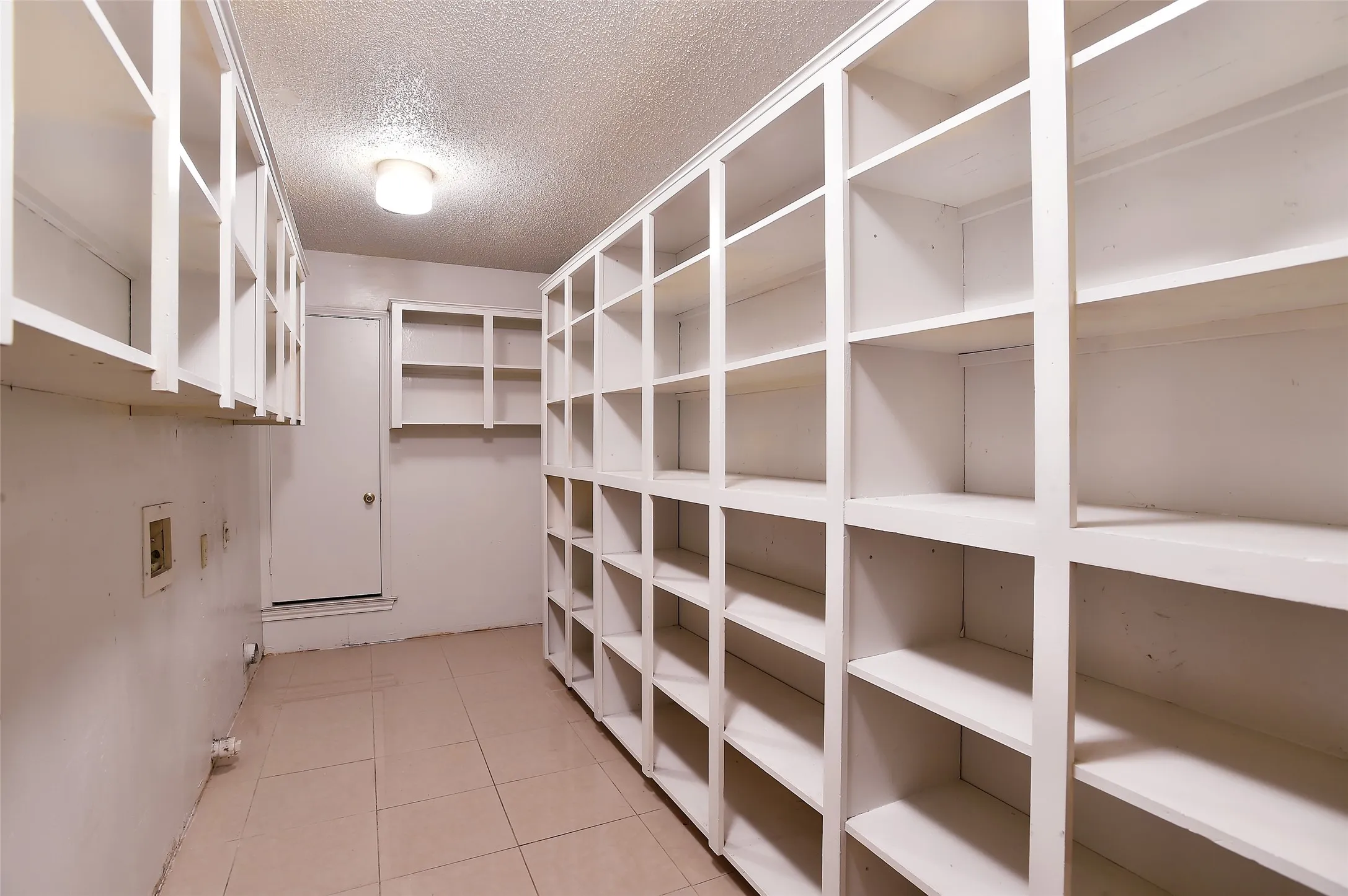 Pantry and laundry room.  Look at all that shelving!