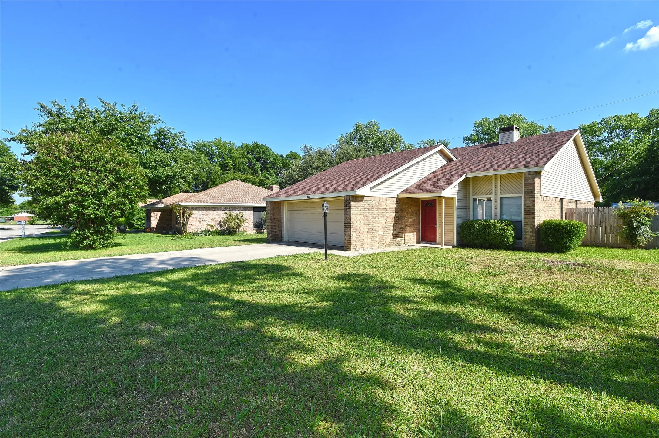 Large front yard with shade