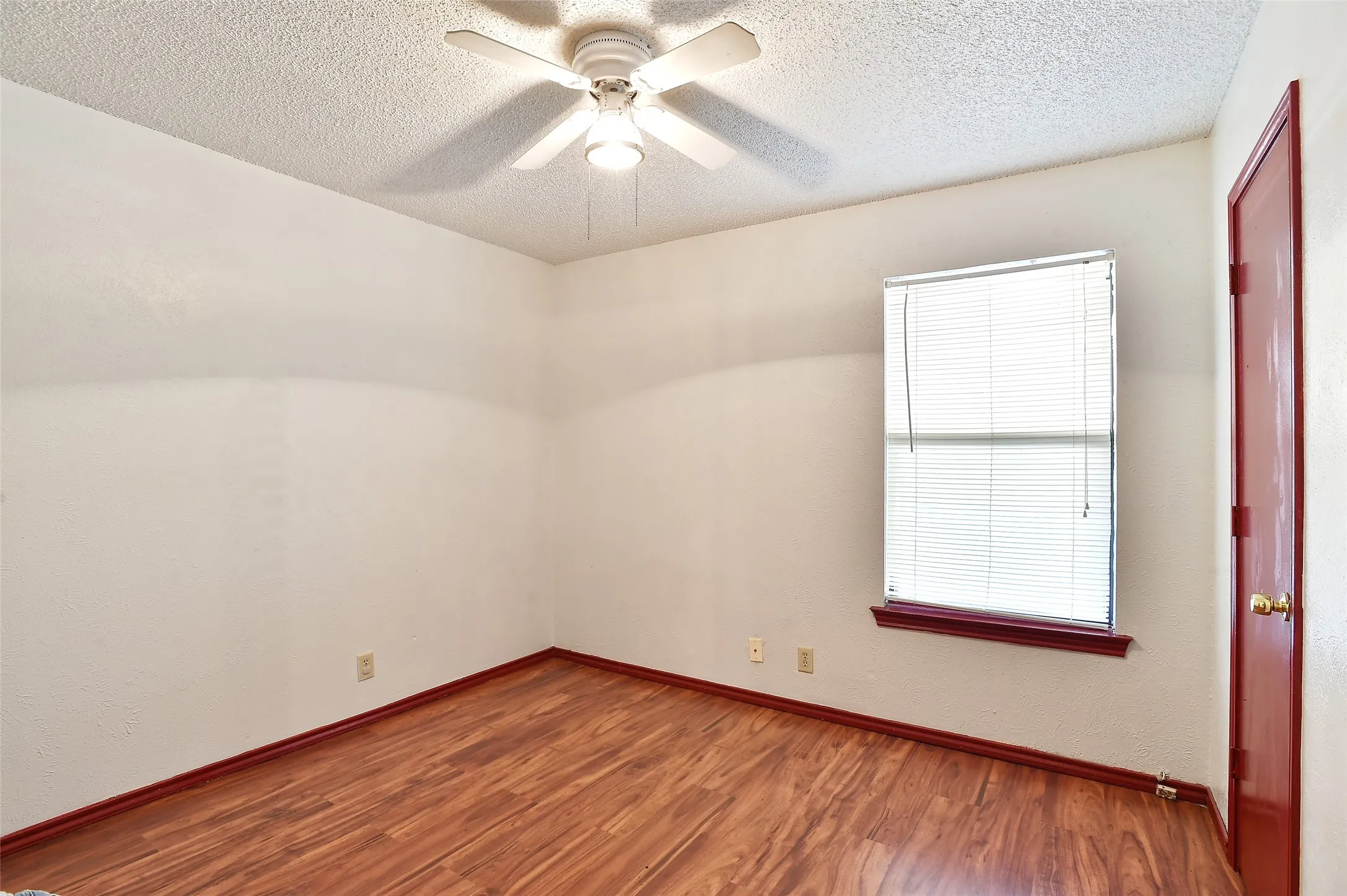 Bedroom with ceiling fan.