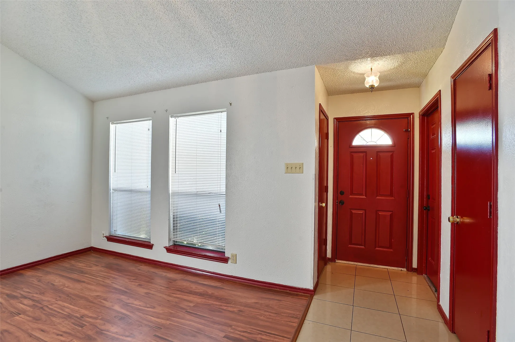 Just off the entryway are coat closets and the door to the garage.