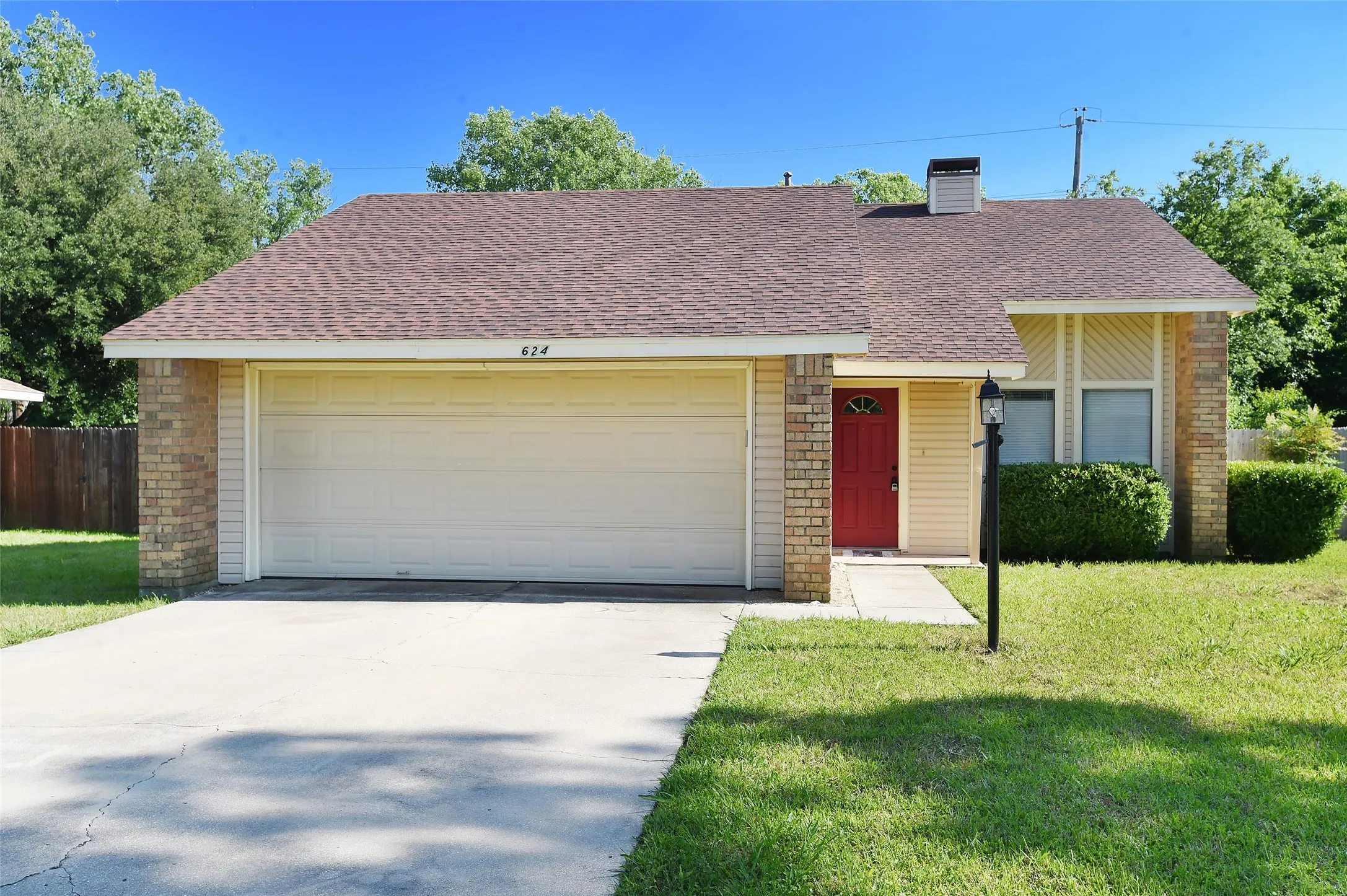 Mature landscape, decorative trim and timeless light post all add to the curb appeal of this home.