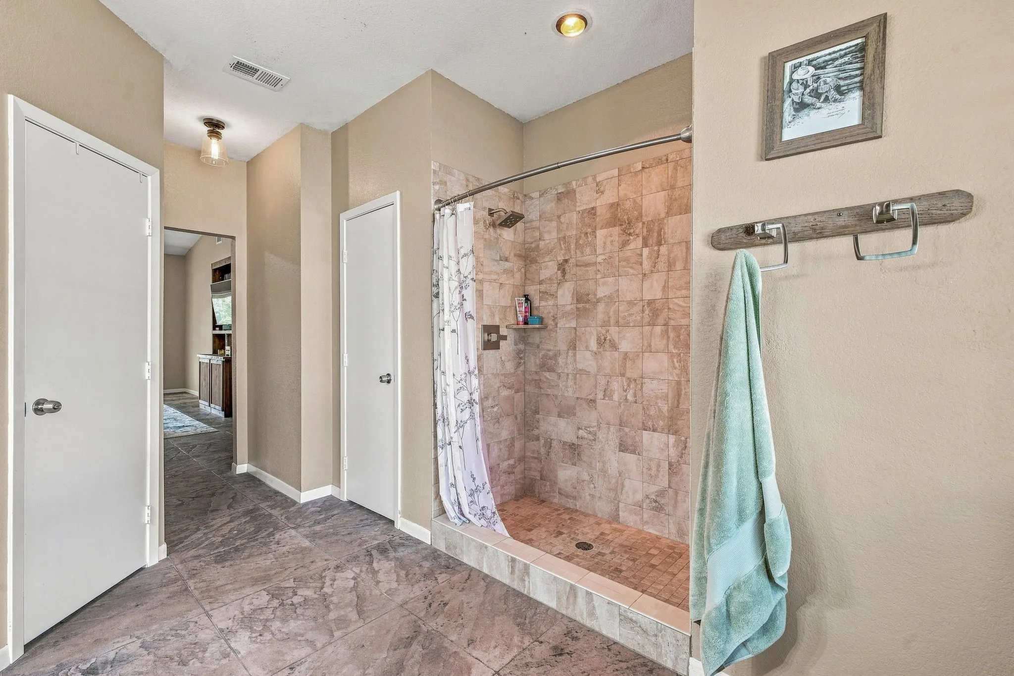 Primary Bathroom. Walk-in shower. Large custom shelving walk-in closet & linen closet. Double Vanities