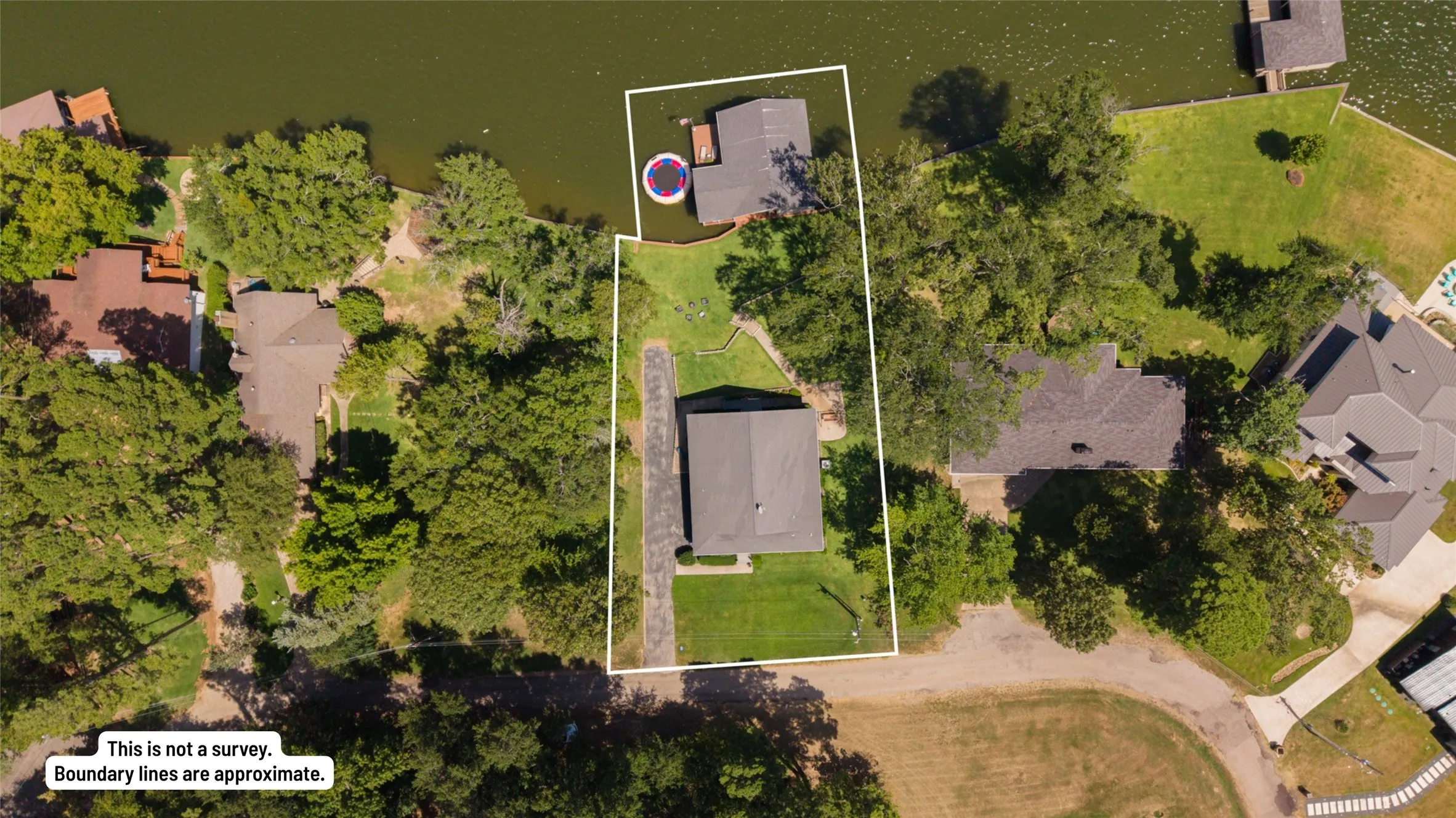 Waterfront property with a private dock and mature trees