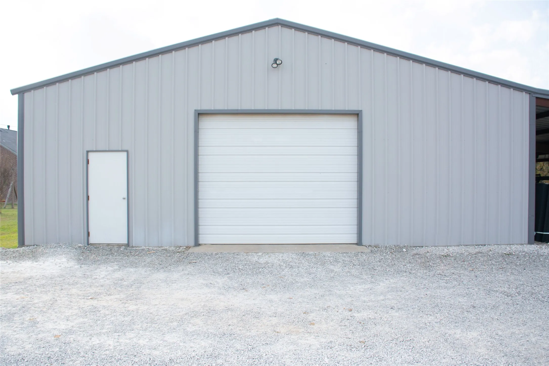 Barn and workshop with equipment shed