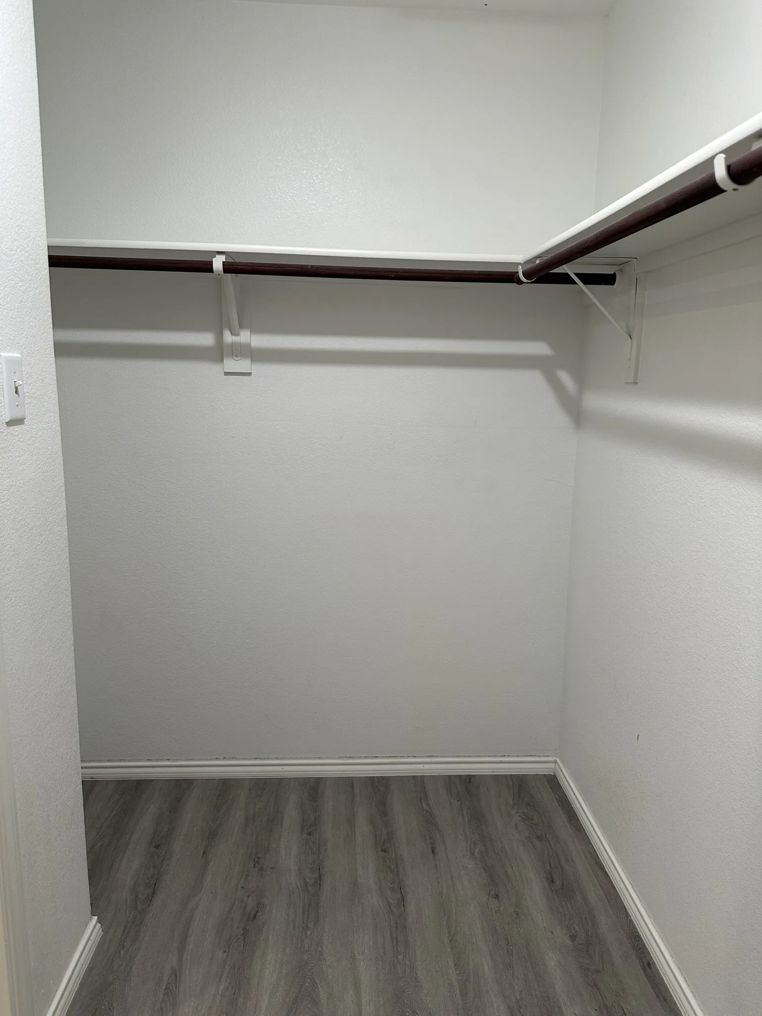 Spacious closet featuring wood finished floors