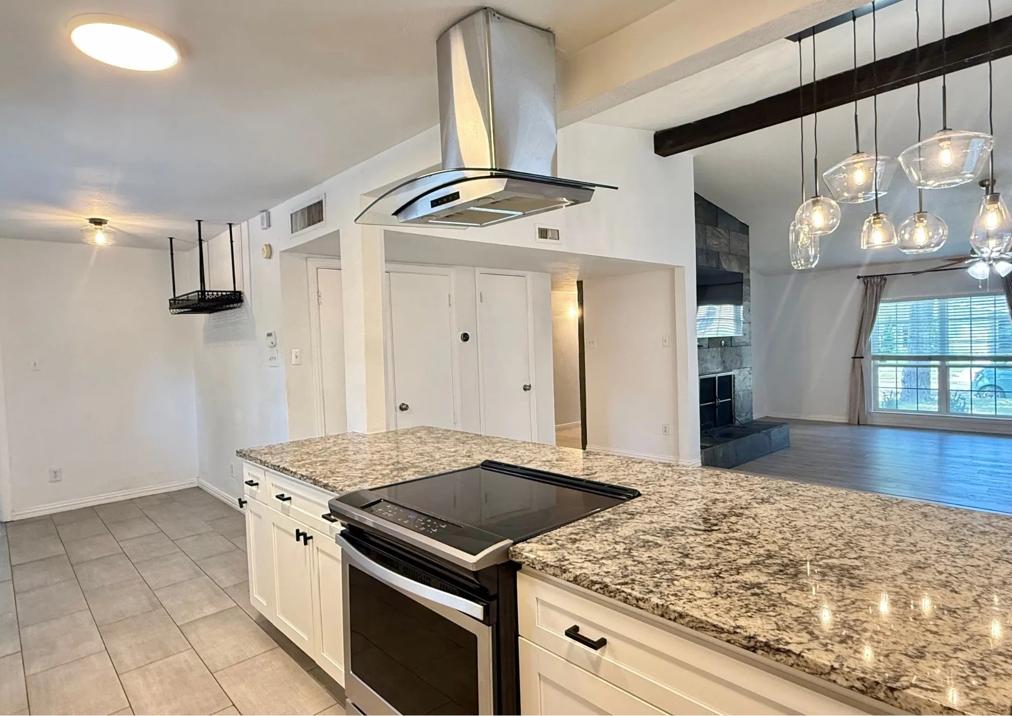 Kitchen island with stone-finish countertop and built-in electric range
