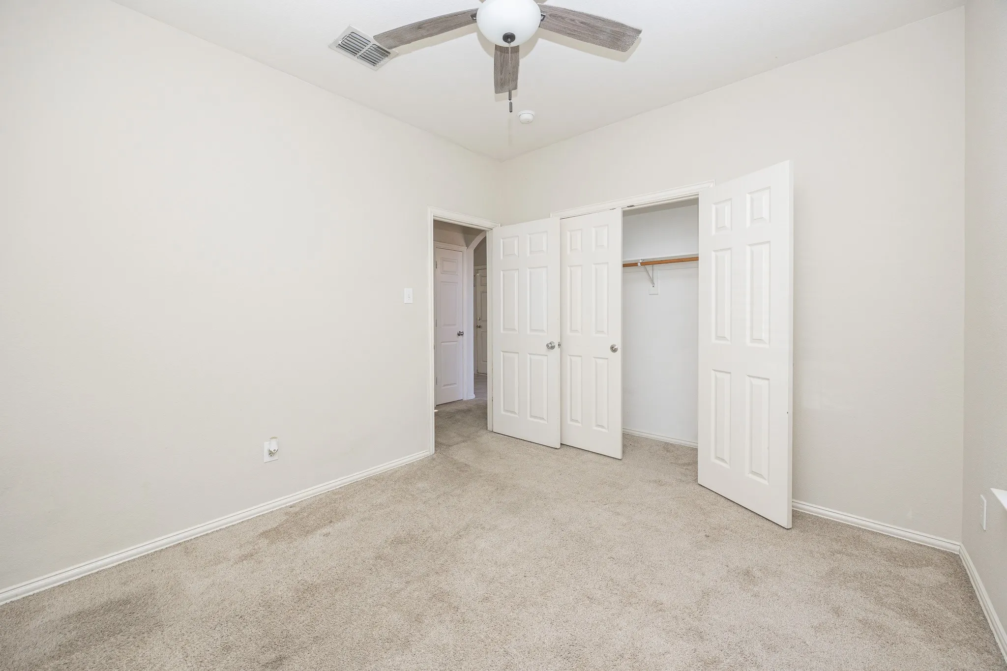 Neutral-toned carpeting throughout