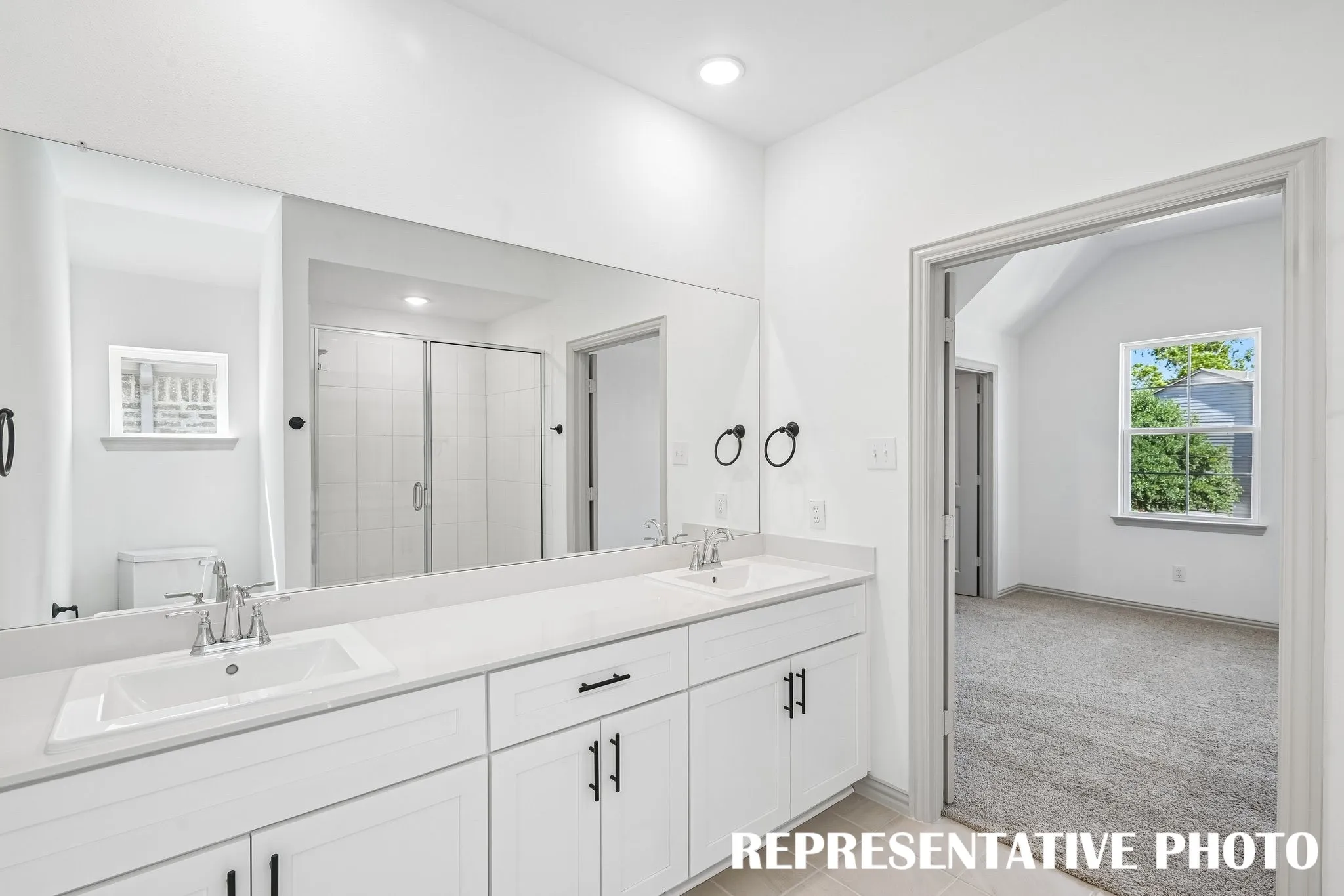 Ample room for two in this wonderful owners bath.  REPRESENTATIVE PHOTO