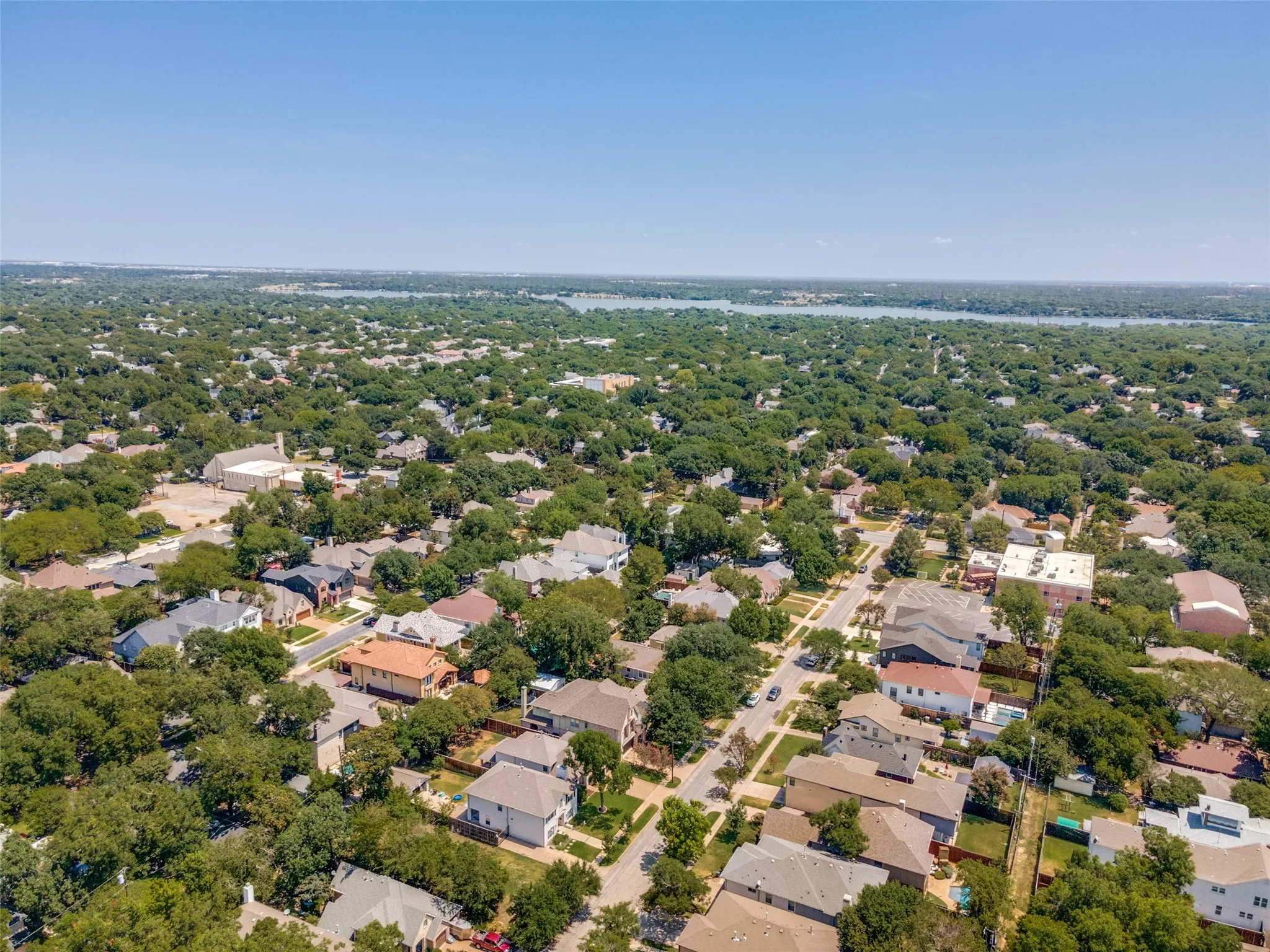 High-altitude aerial view highlighting the beautiful green pocket of Lakewood Heights and its unbeatable location.