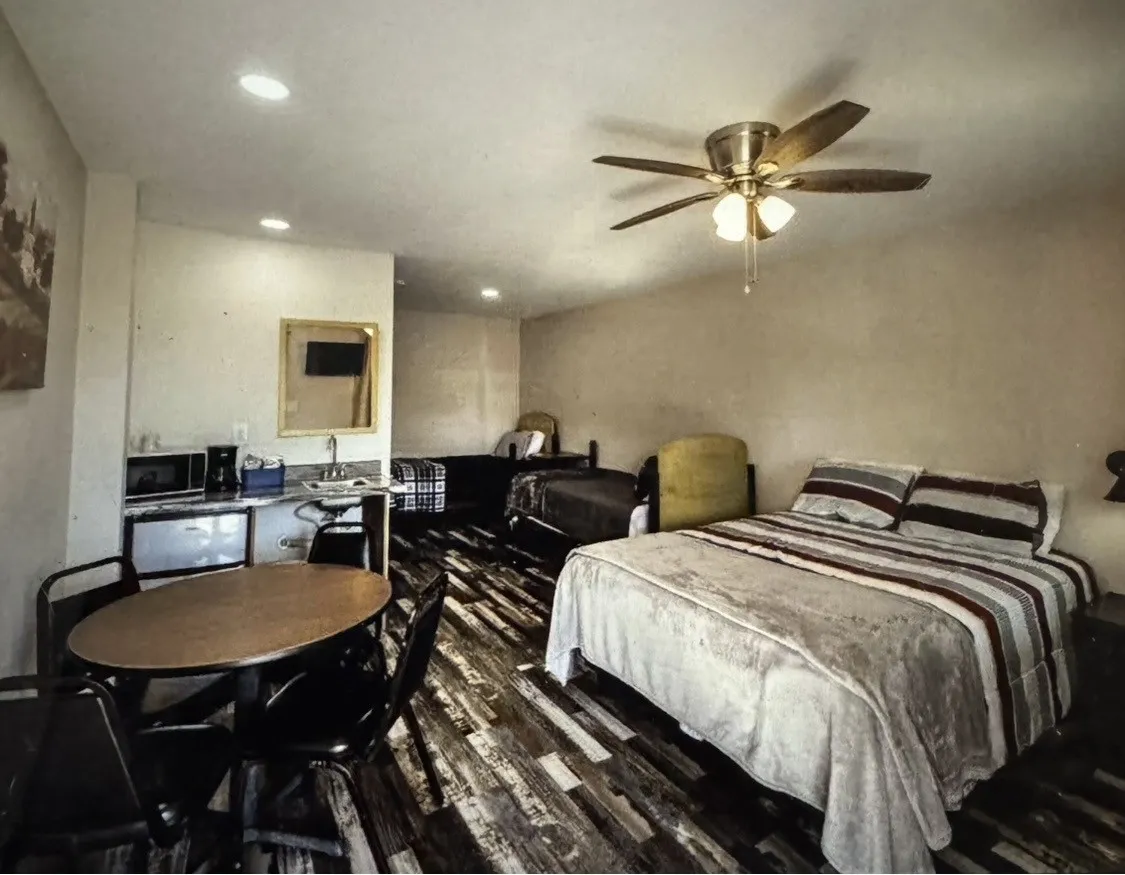 Wood-finish flooring, recessed lighting, and a ceiling fan