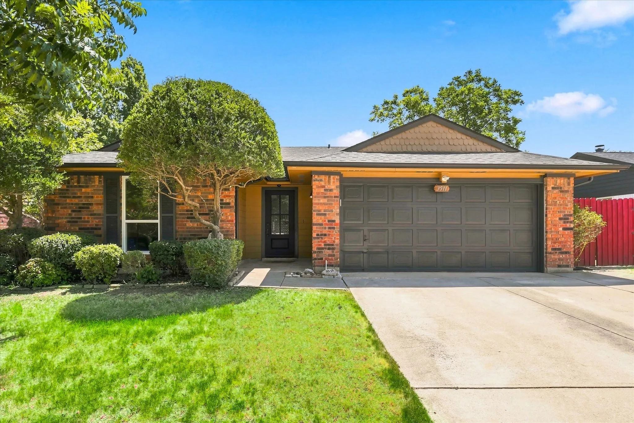 Brick exterior with a prominent two-car garage