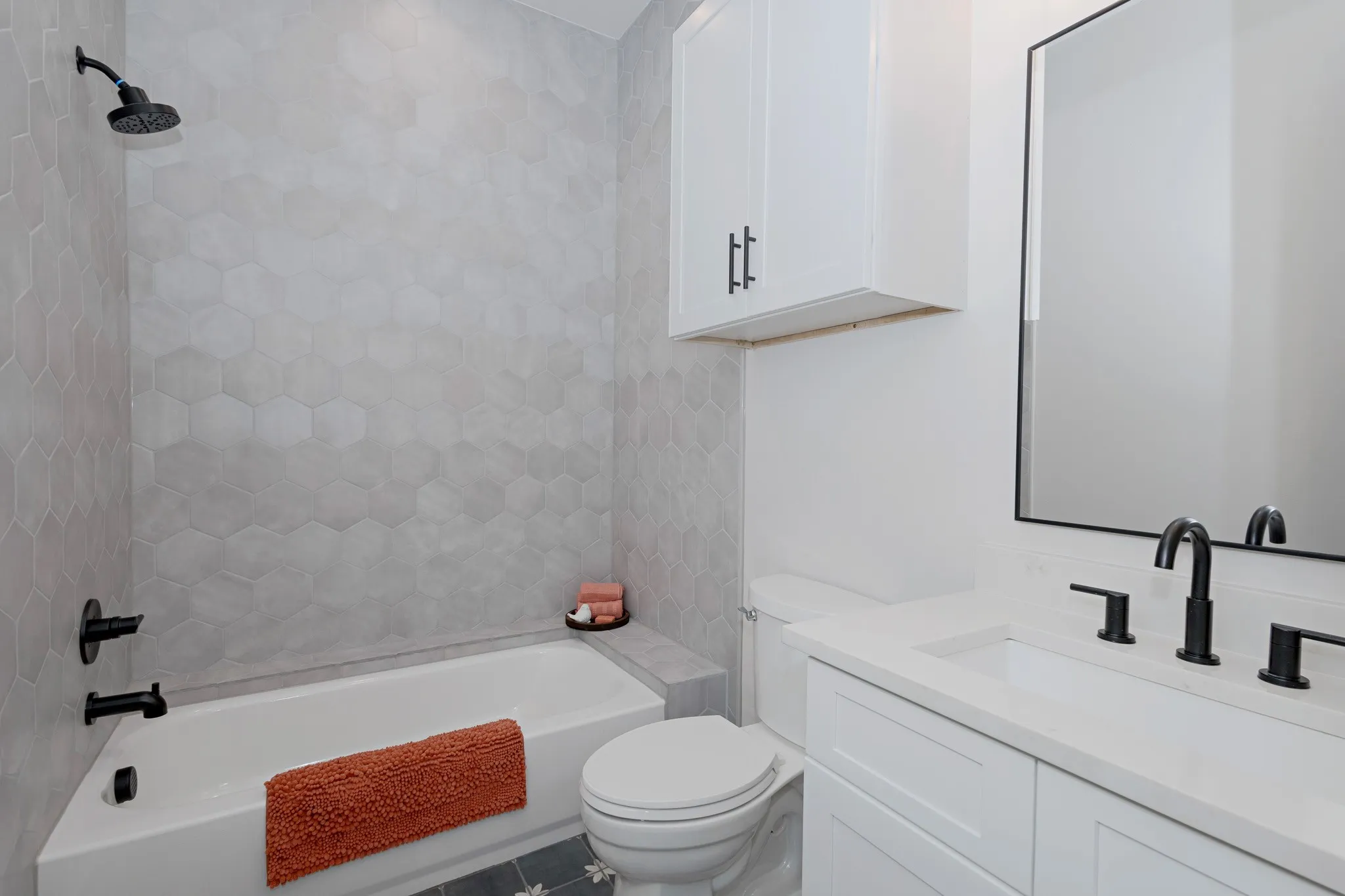 Modern High-End Finishes and calming tones elevate this Full Guest Bathroom.