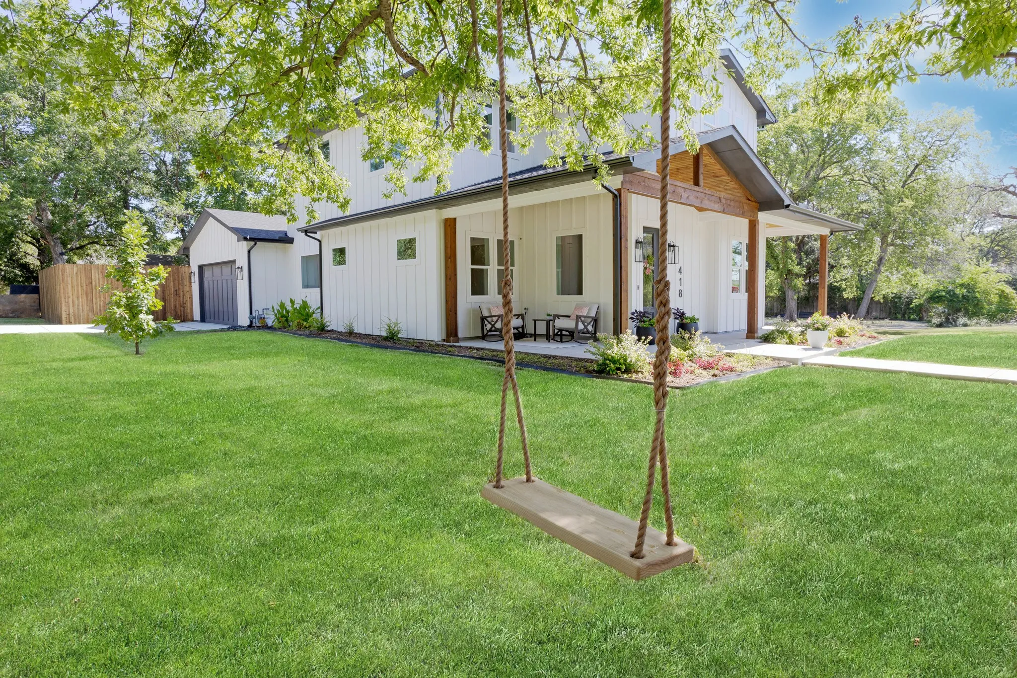 This peaceful yard and porch are made for slow mornings and long quiet evenings.