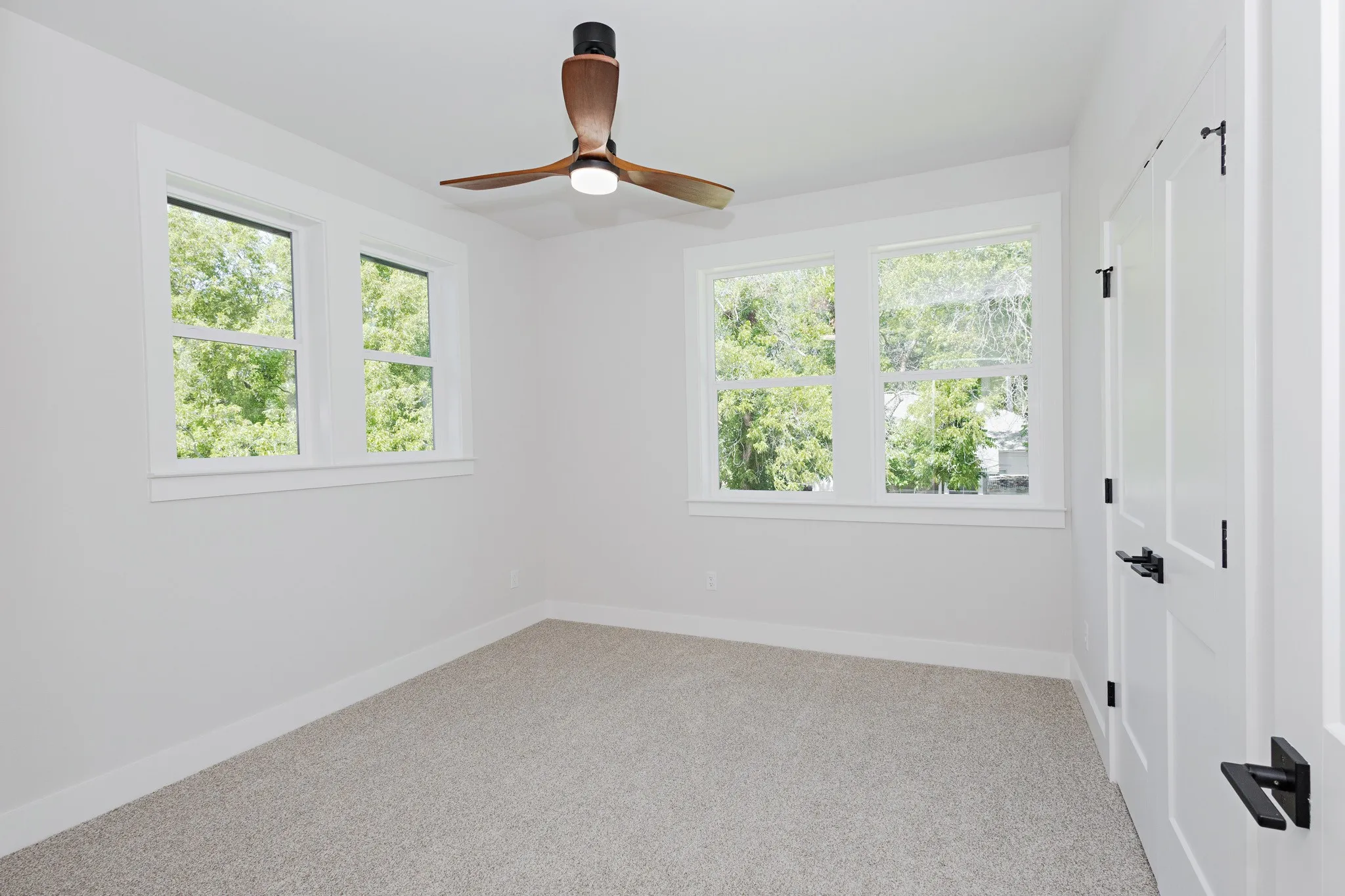 Guest Bedroom 2 offers soft natural light and a comfortable layout.