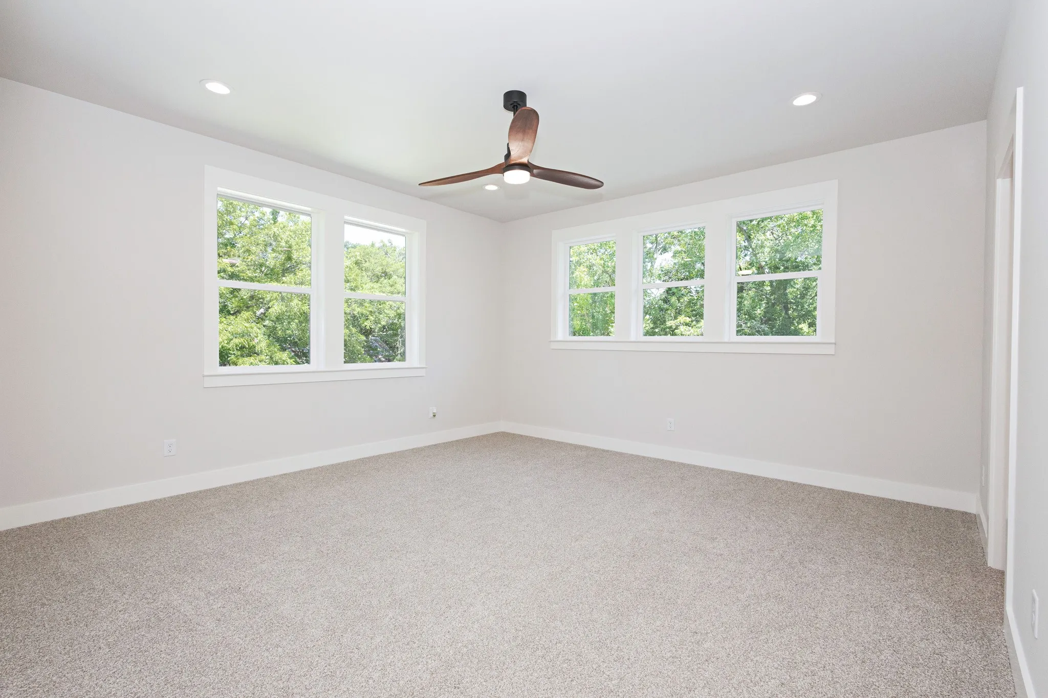 Wake up to serene tree-line views in this private Owner’s Suite. All walls in the home are insulated offering peace and privacy.