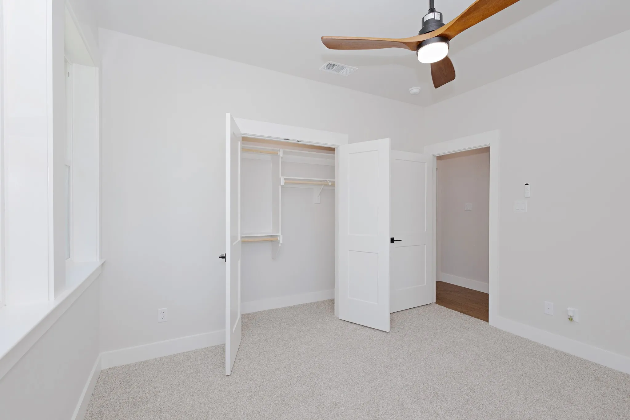 Guest Bedroom 2 full size closet with shelving.