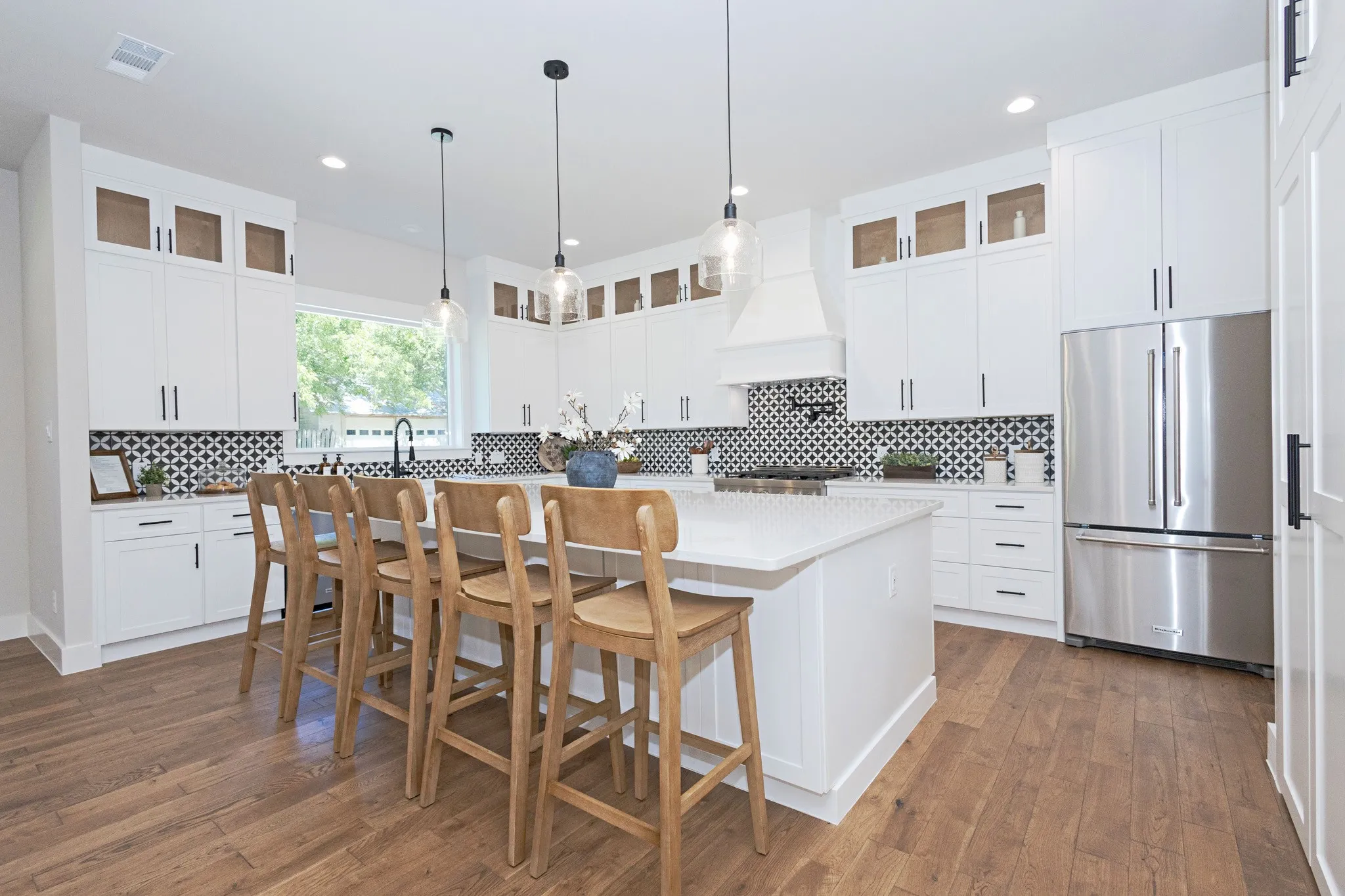 The Heart of the Home- Bright, Open, and Beautifully Designed with Quartz Countertops, Premium KitchenAid Appliances and room for everyone.