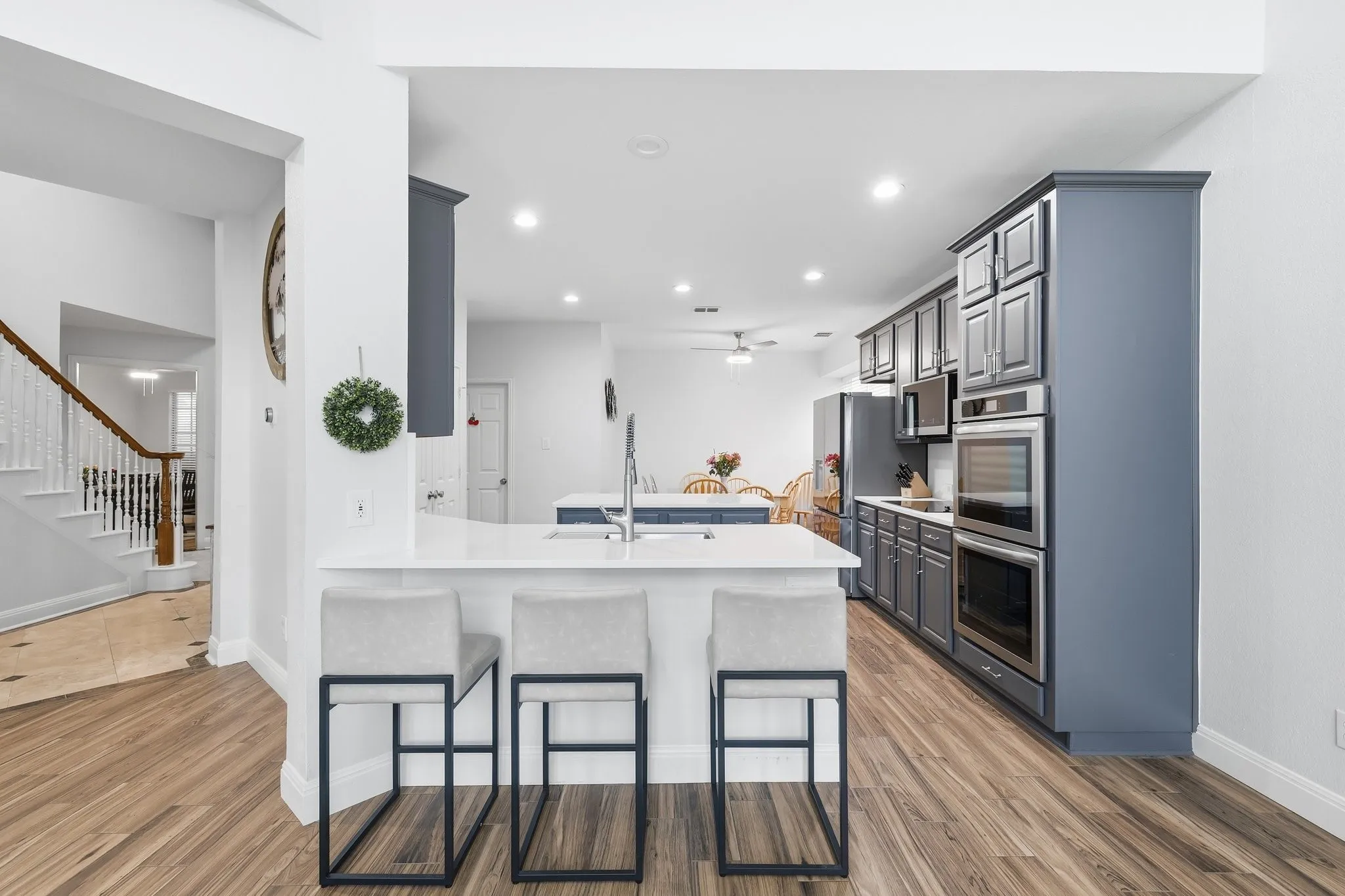 Gorgeous updated kitchen with new countertops, backsplash and stainless appliances.
