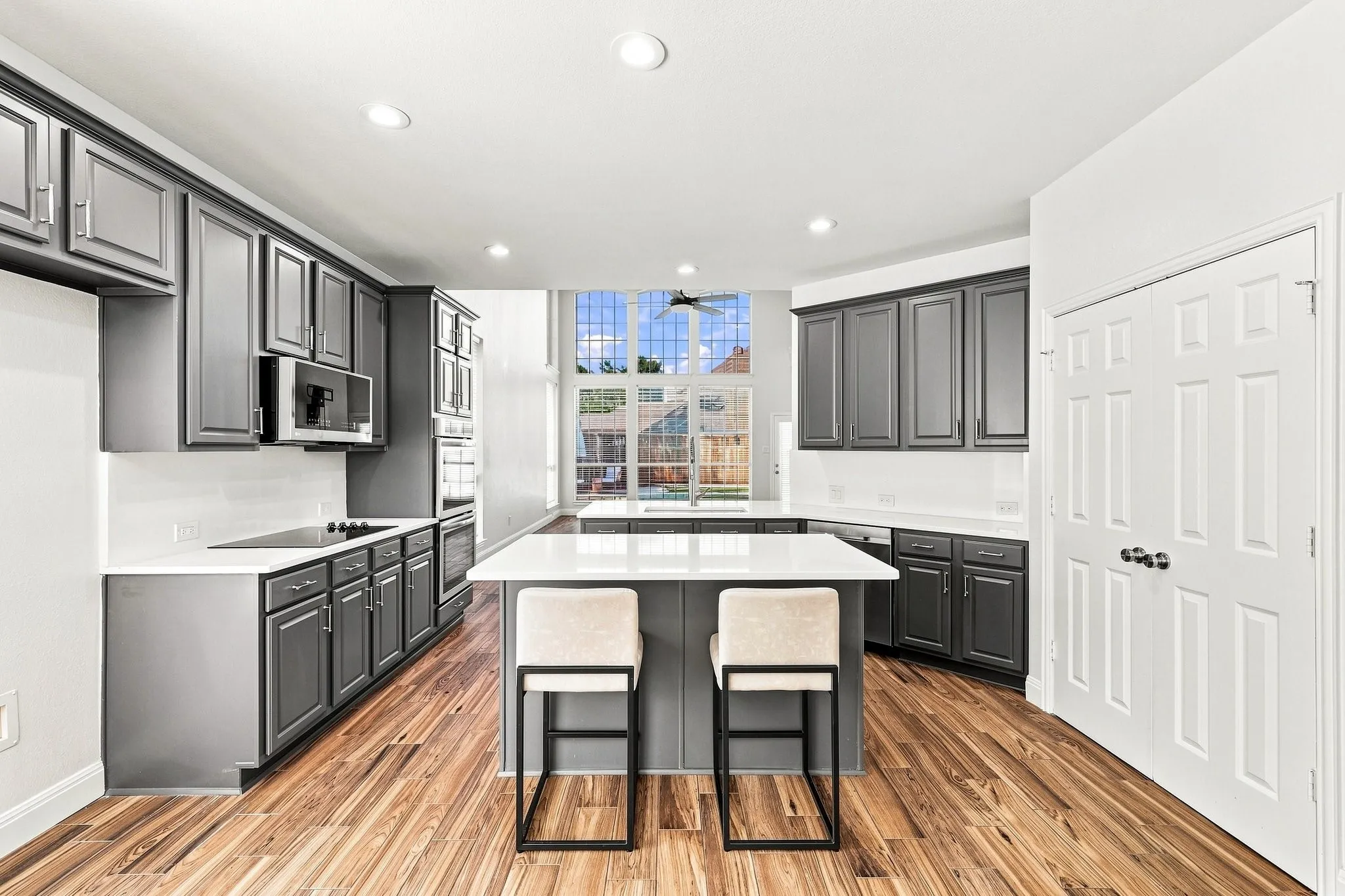 Large pantry and additional barstool seating on the island. This home is meant for entertaining and family time too!