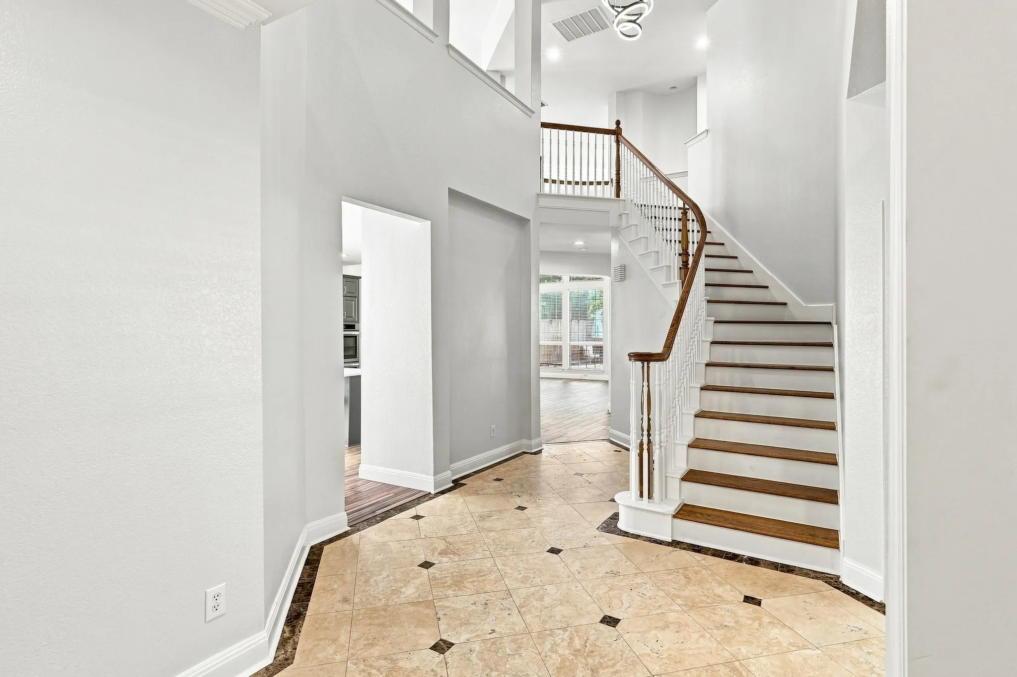 Foyer and decorative stairway.