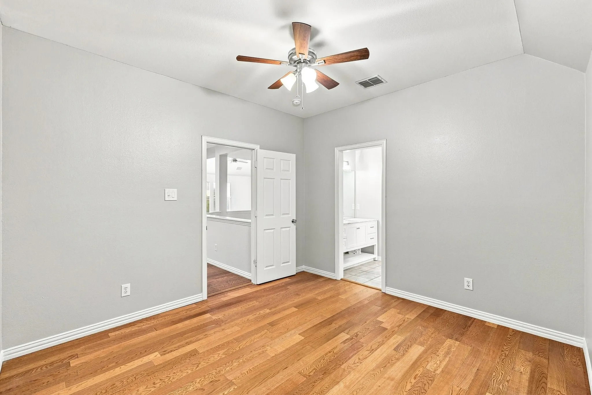 This bedroom upstairs has an updated ensuite bath.