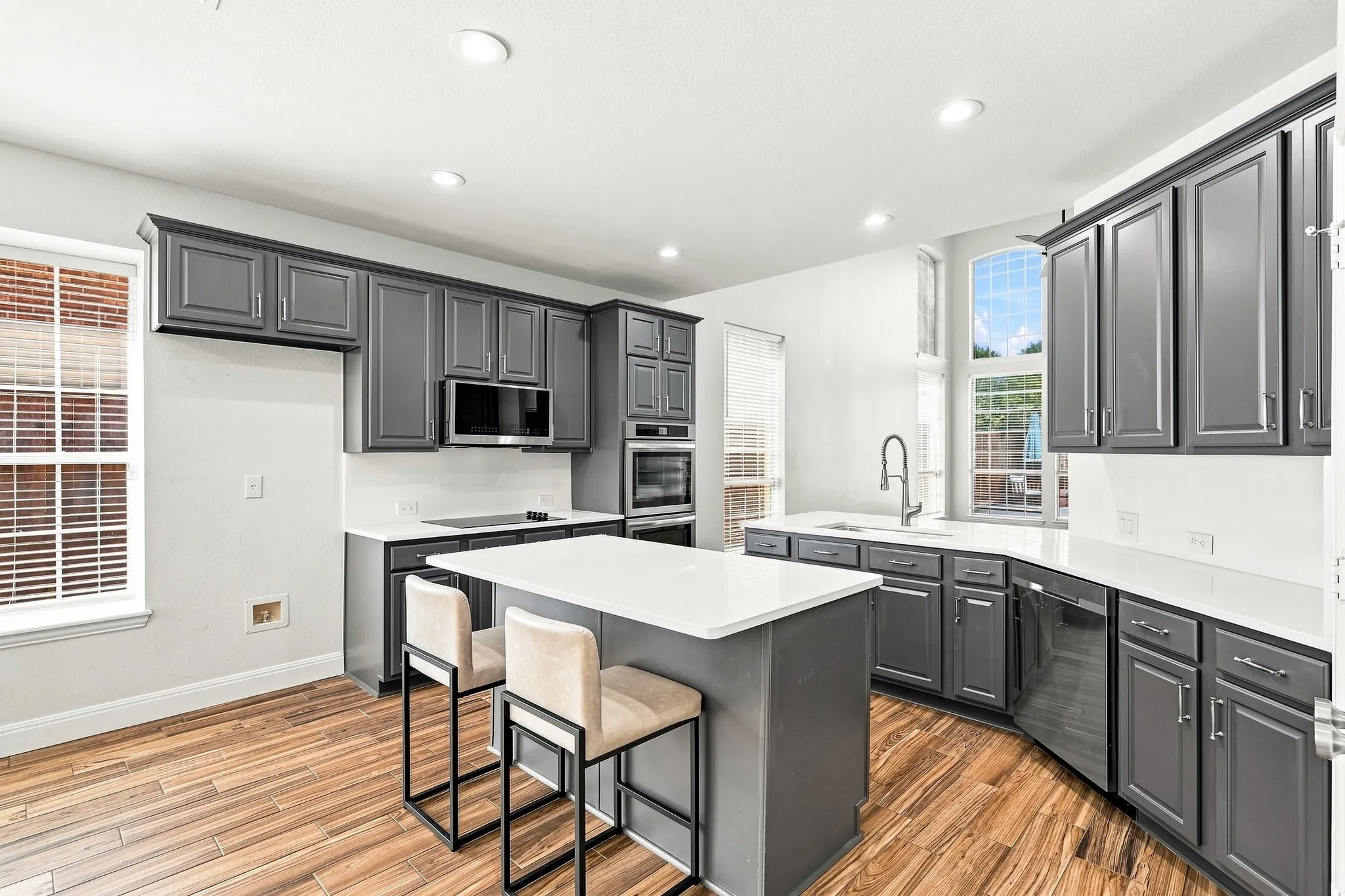 Don't you love this color of grey! It looks so rich with the stainless appliances and cabinet hardware!
