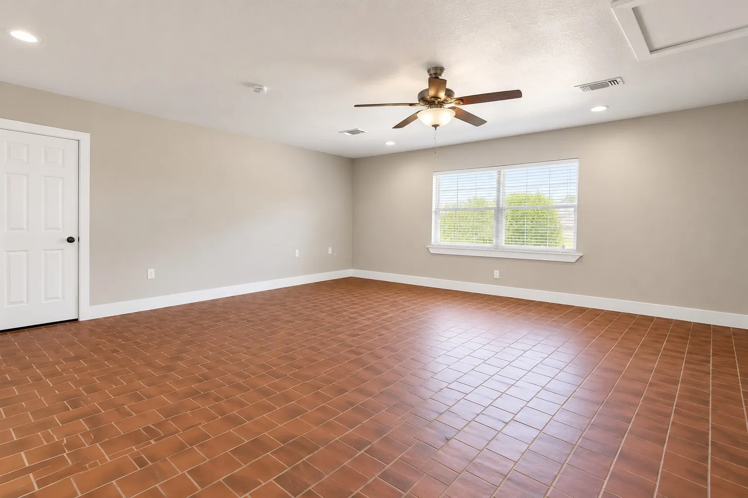Converted garage is great space for 2nd Living area, media room, door to carport