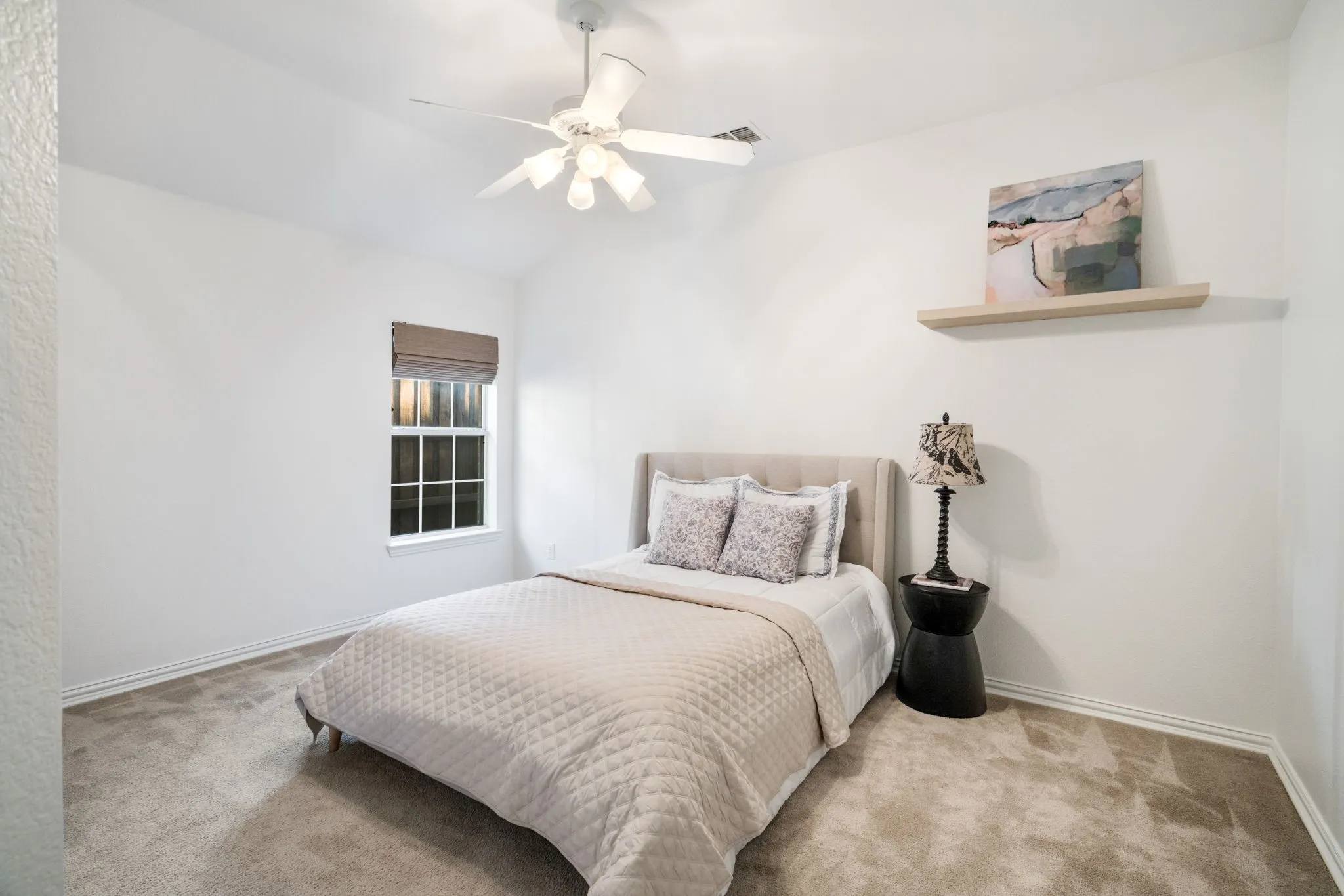 Secondary Bedroom down is beautifully painted and has energy efficient fan and lighting, with a built in close and plenty of space.