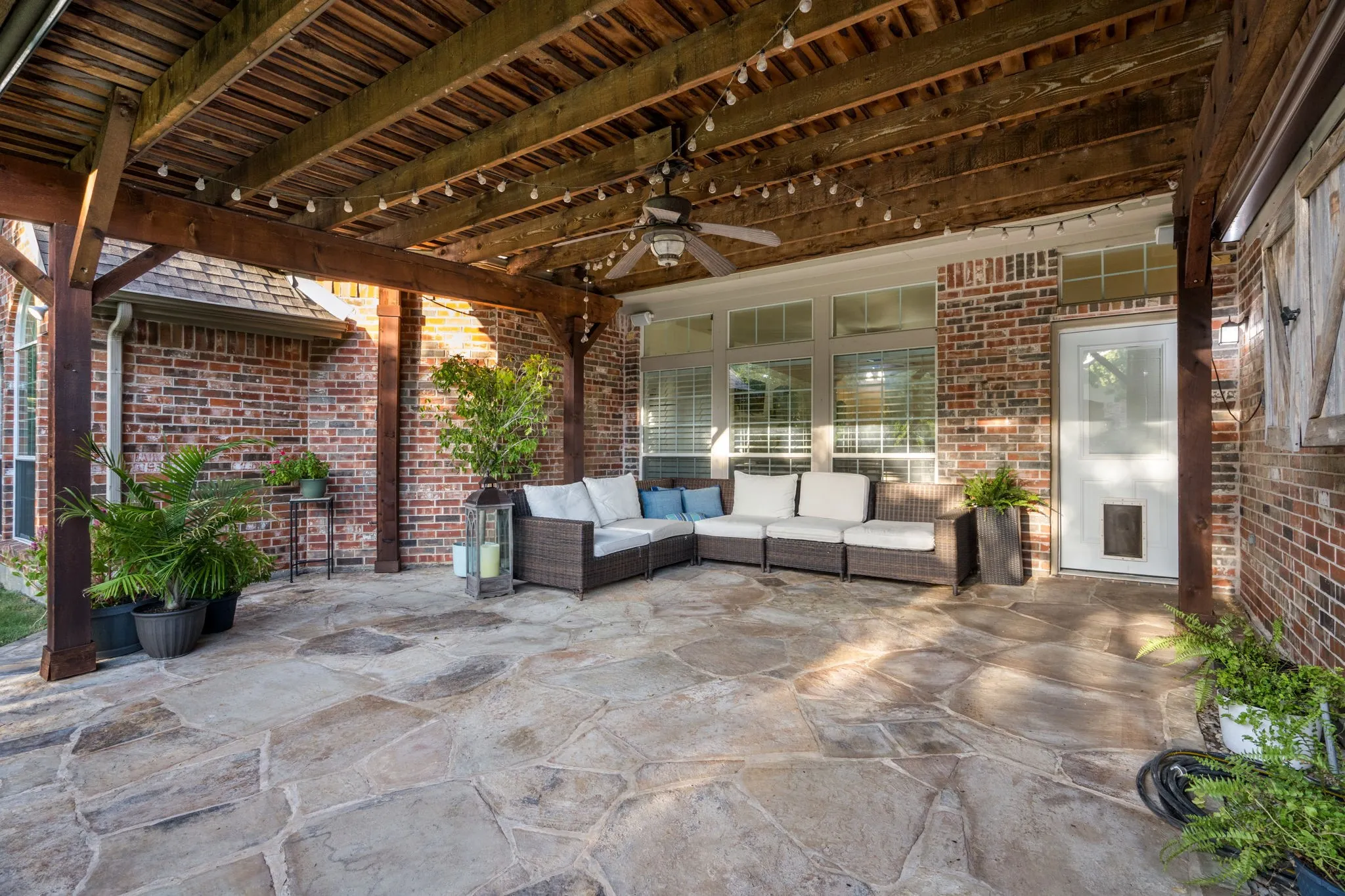 Huge covered pergola on patio, with plenty of room for outdoor living.