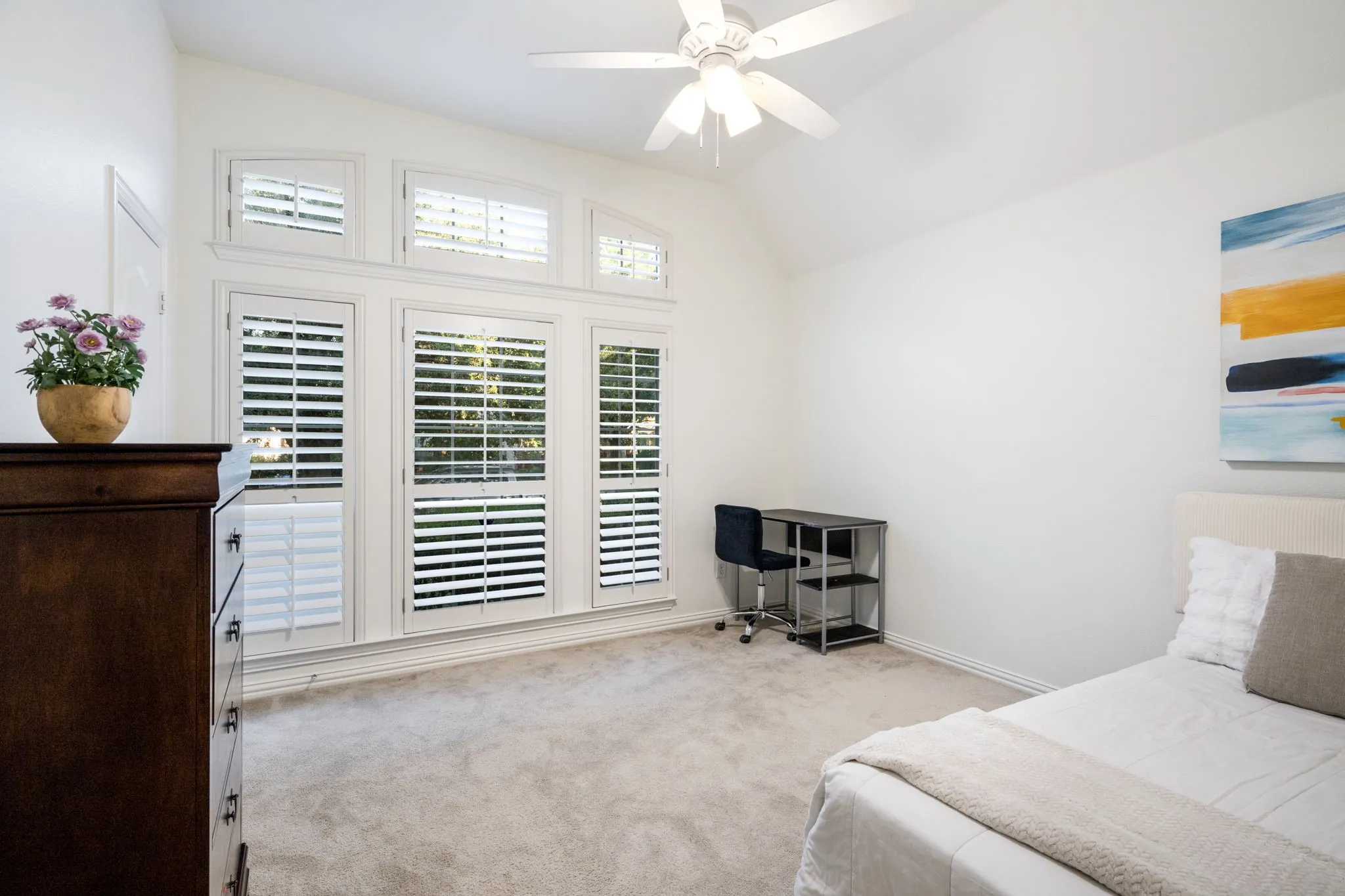 Secondary bedroom with plenty of room to expand and even large enough for two beds, plus a built in close and energy efficient light and fan, with plantation shutters. Newly painted SW Alabaster white professionally.