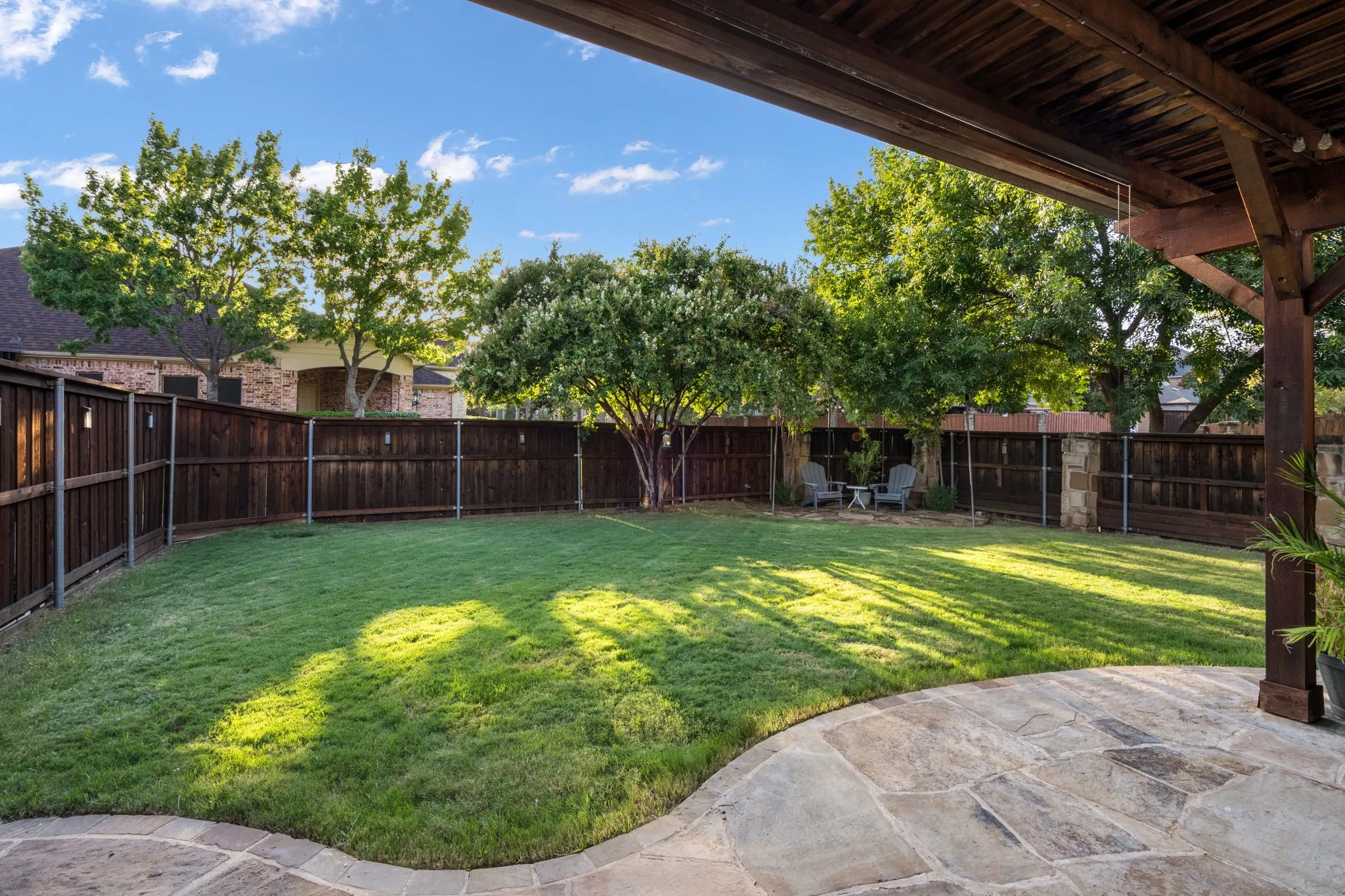 Beautiful pool sized yard or great for a putting green and place for hosting!