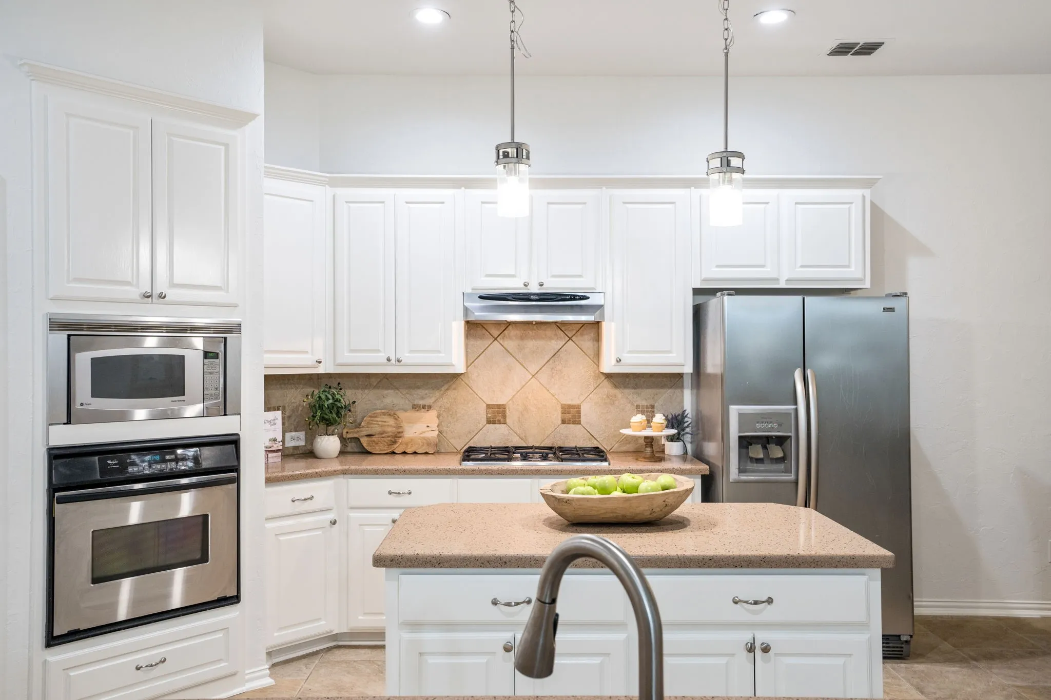 This kitchen awaits your stamp to make it your own, but the current owner is very happy with their esthetics and loves the contrasting warmth. You can do new quartz and pick your own dream color at your cost! We can help.