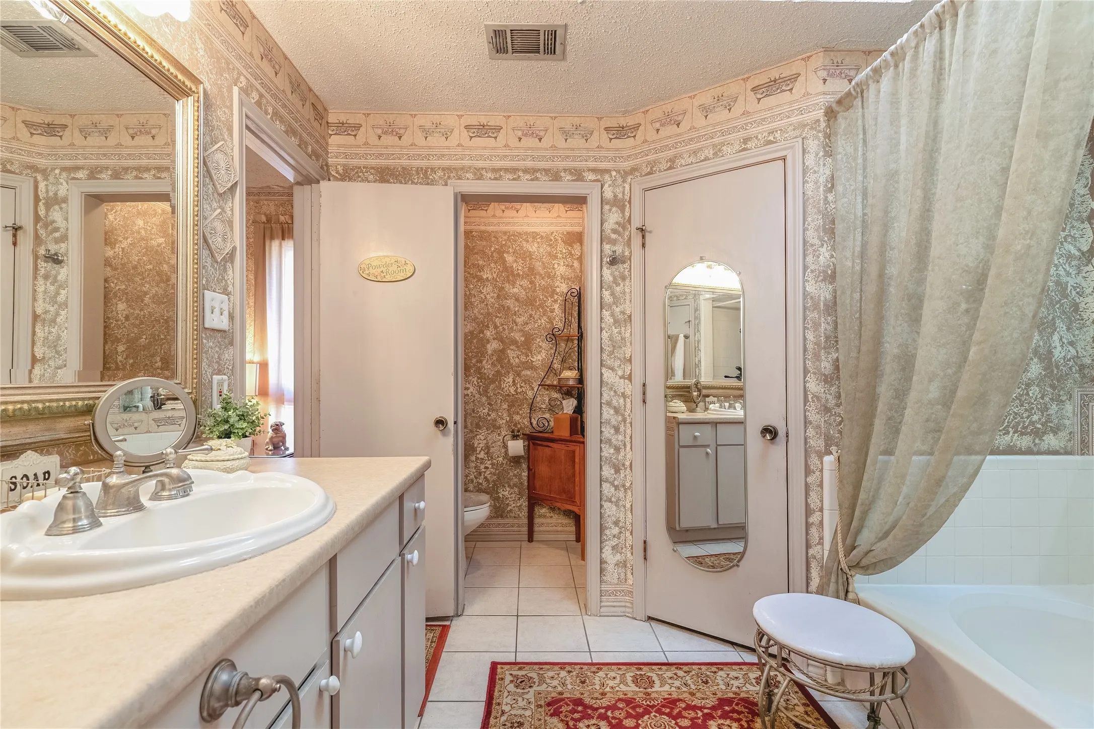 Vanity with an integrated sink and brushed nickel faucet