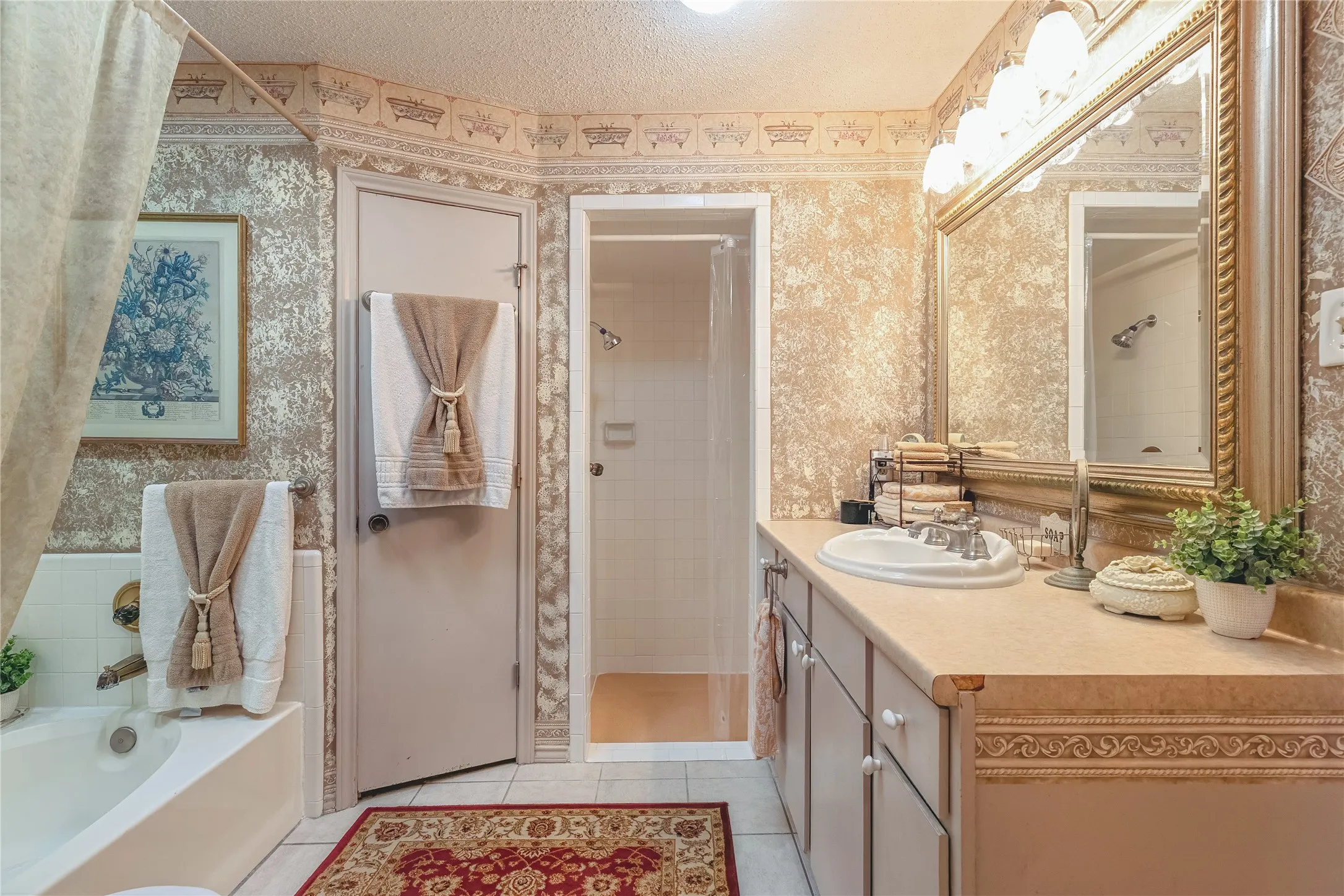 Vanity with an integrated sink, ample counter space, and decorative trim