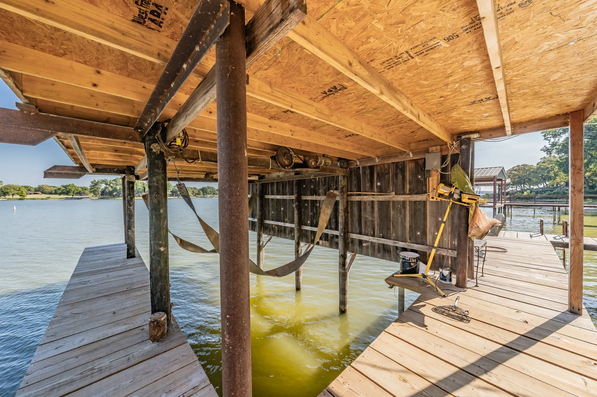 Dock area with a water view and boat lift